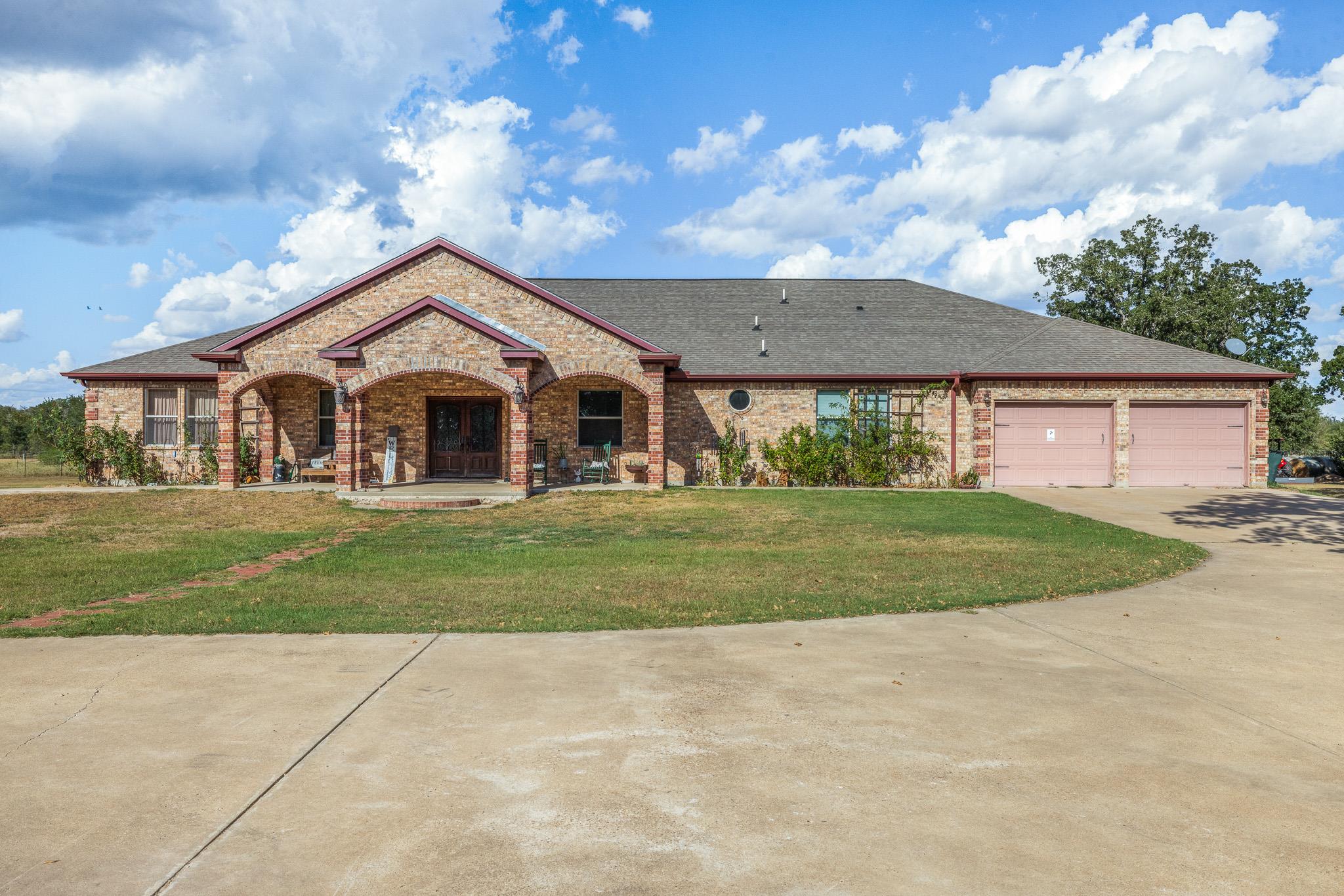 A classic brick exterior with a welcoming arched 