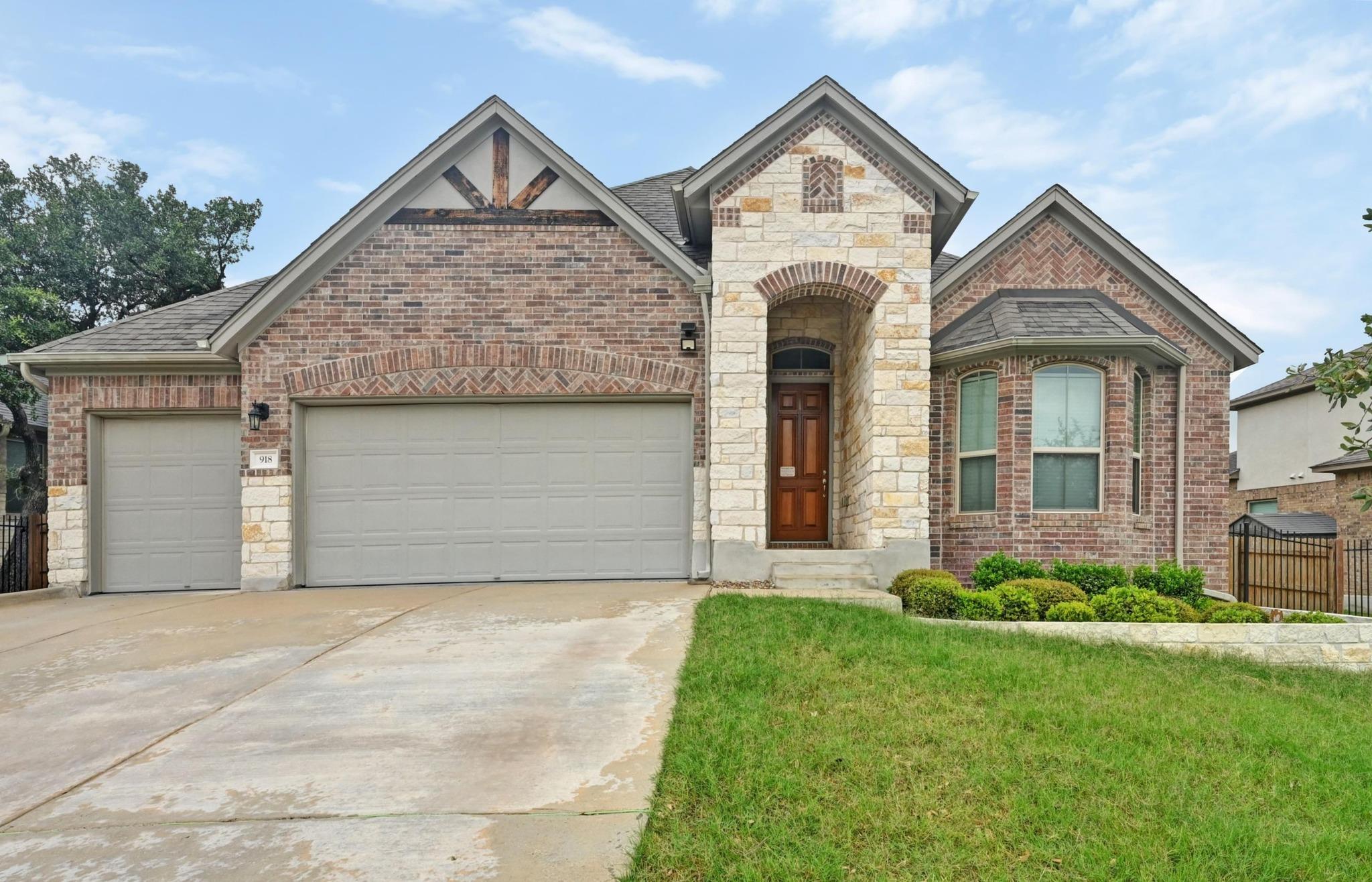 A charming brick and stone facade welcomes all to