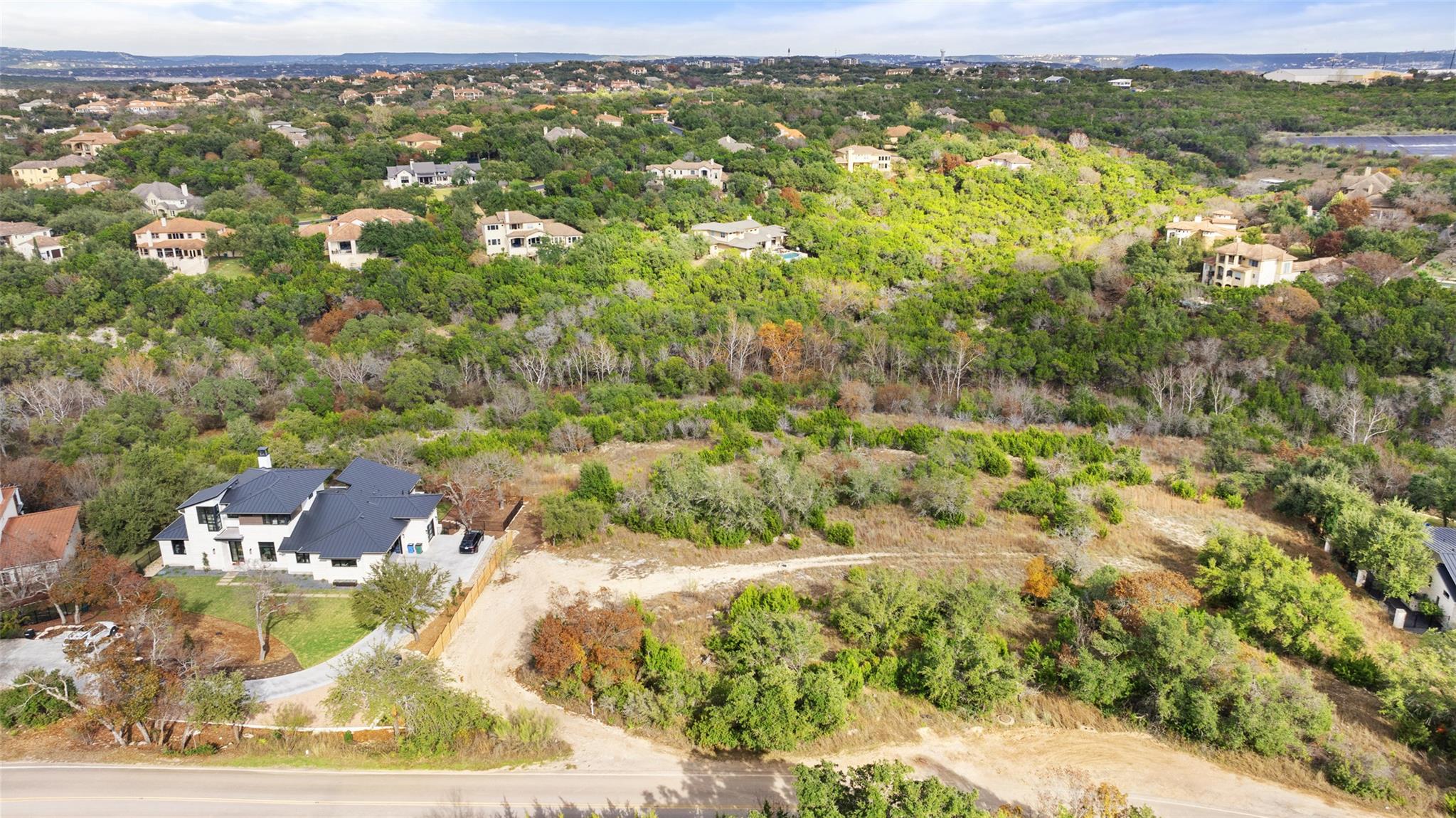 An aerial perspective reveals a modern home nestl