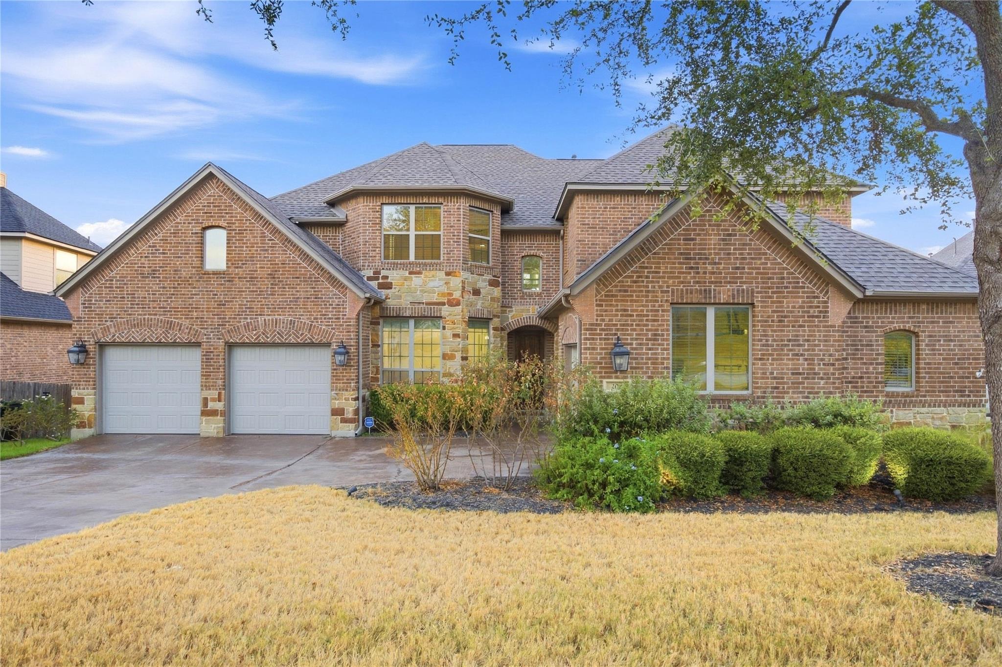 A classic brick exterior and multiple gables crea