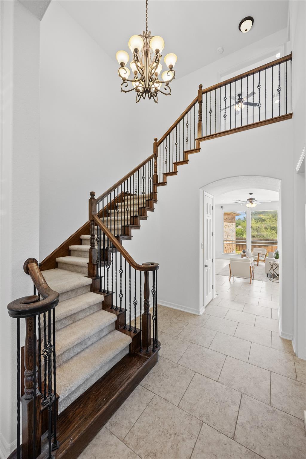 An elegant staircase with detailed wood and iron 