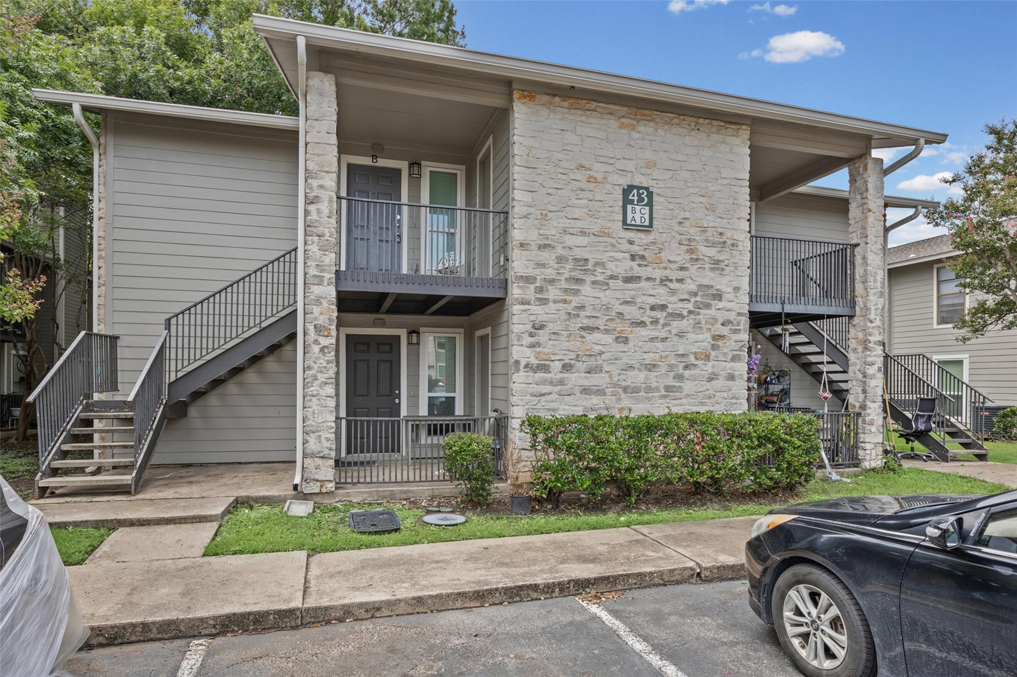 A contemporary apartment building presents a blen