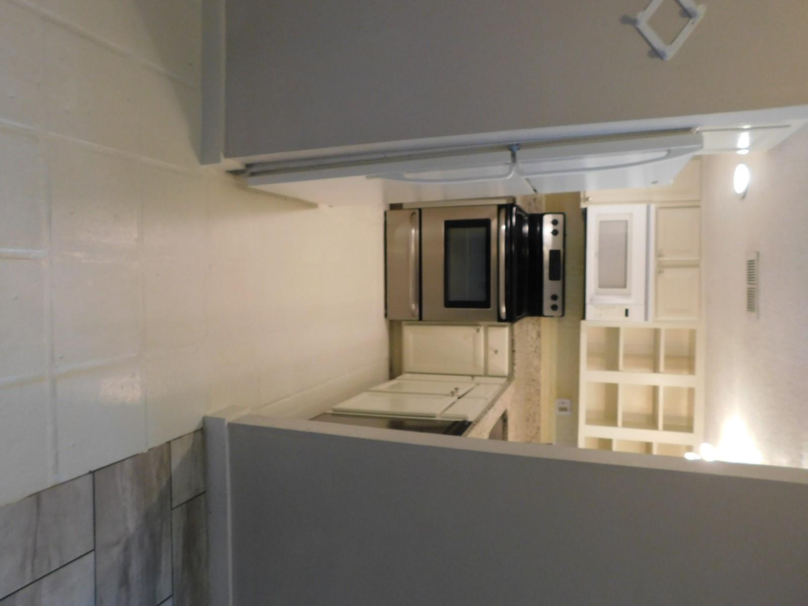 Bright, efficient kitchen with stainless steel ap