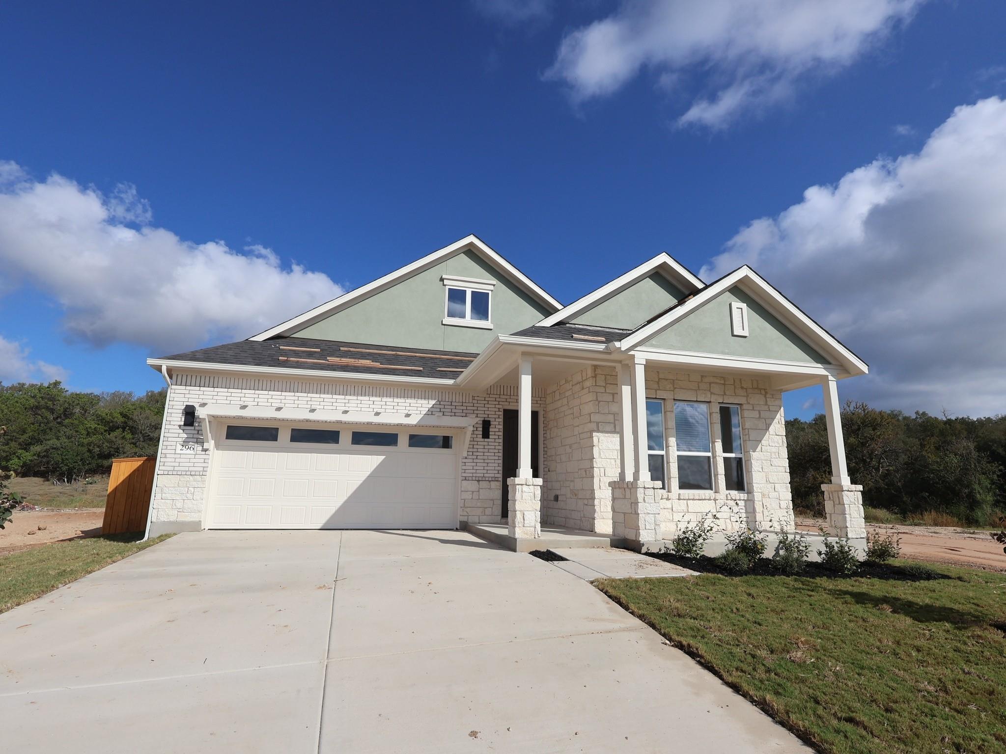 Limestone and stucco accent the exterior of this 