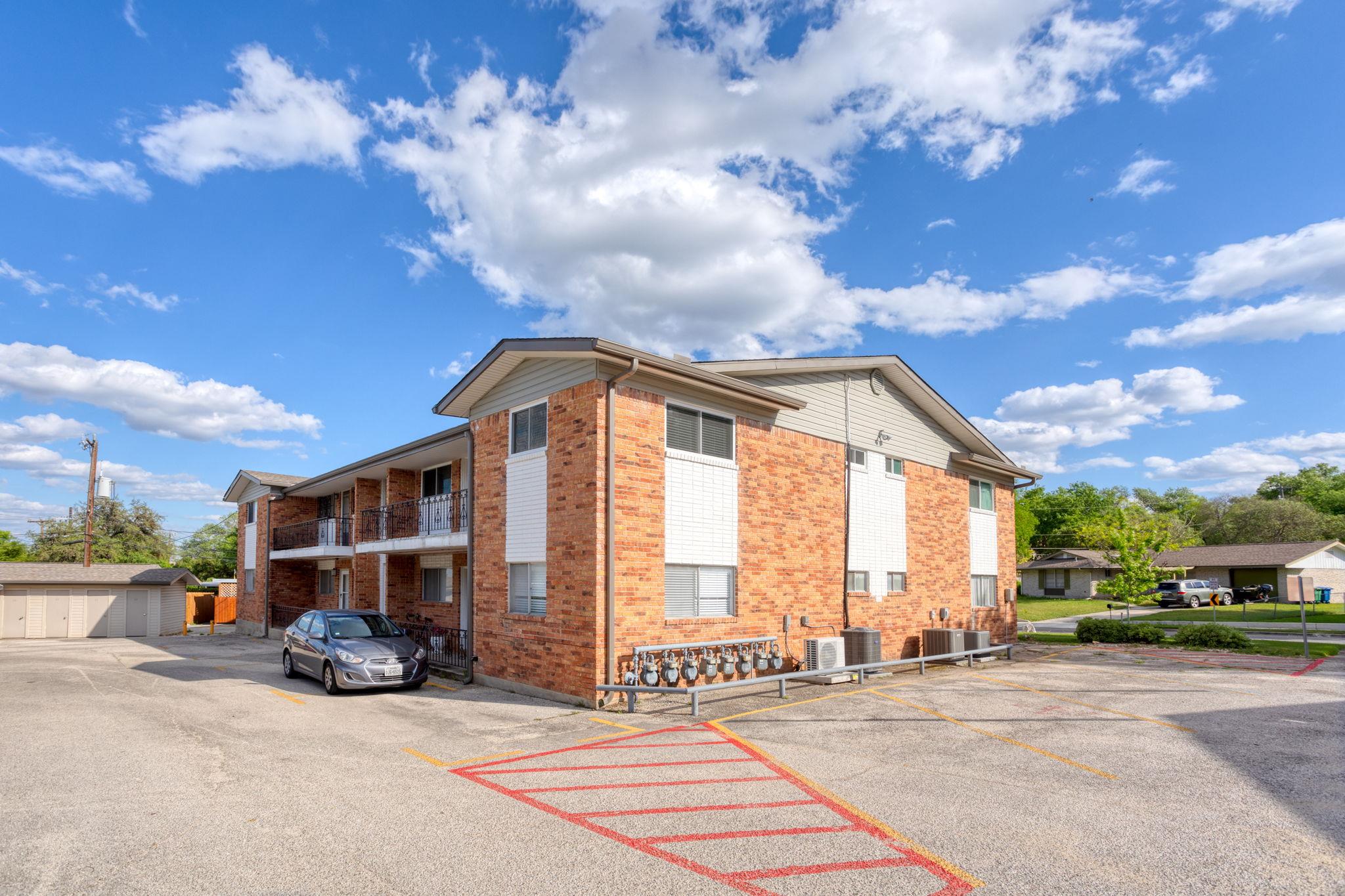 A well-maintained multi-story building with a bri