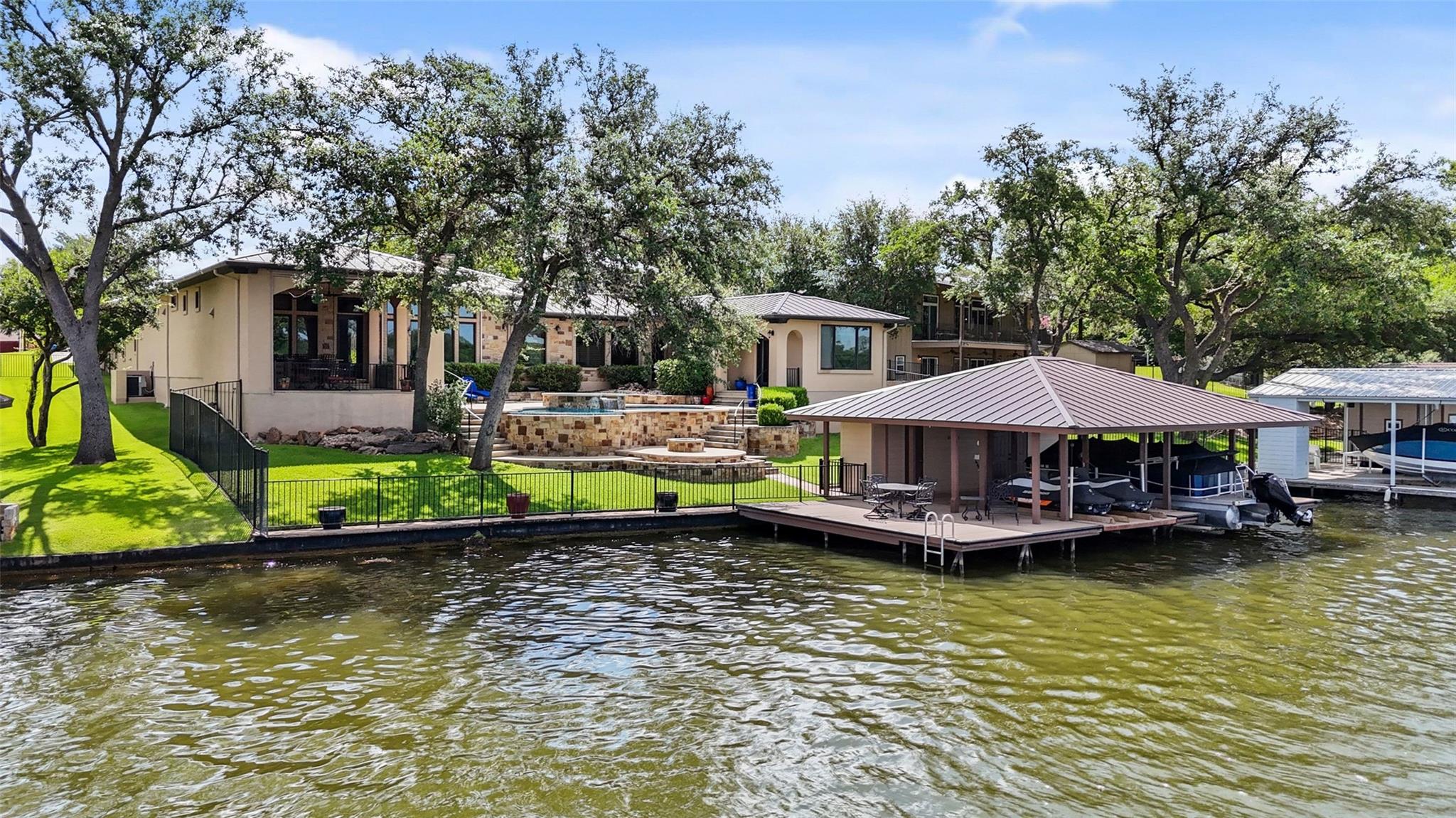 A private boat dock and covered slips offer direc