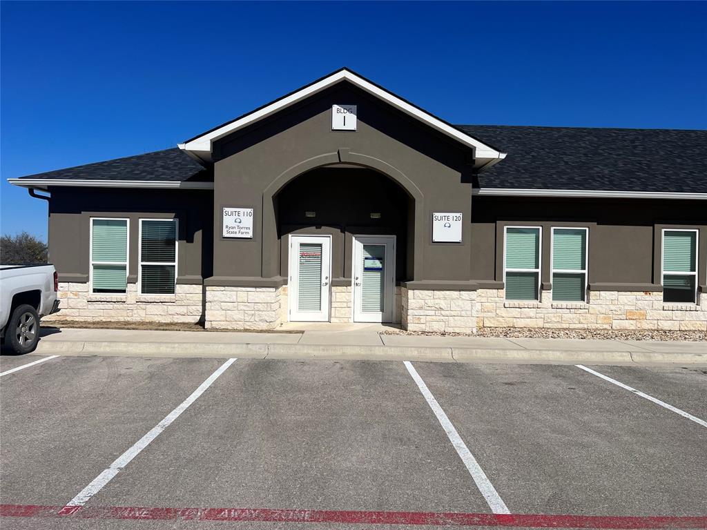 A commercial building with convenient, striped pa
