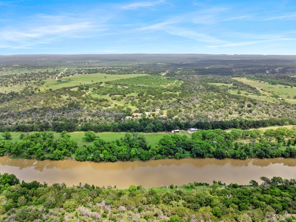 A tranquil river winds through a sprawling landsc