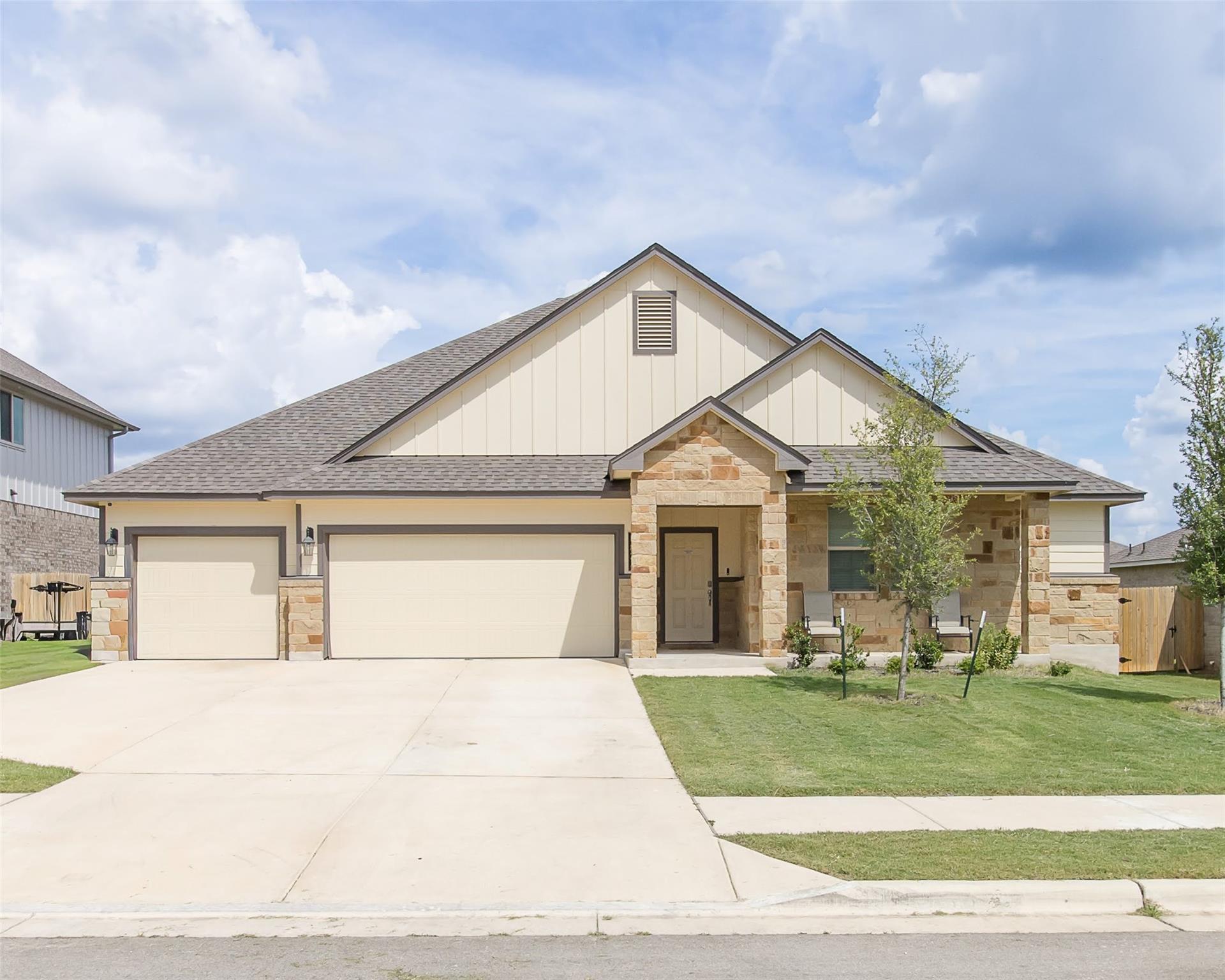 A well-maintained lawn welcomes you to this resid