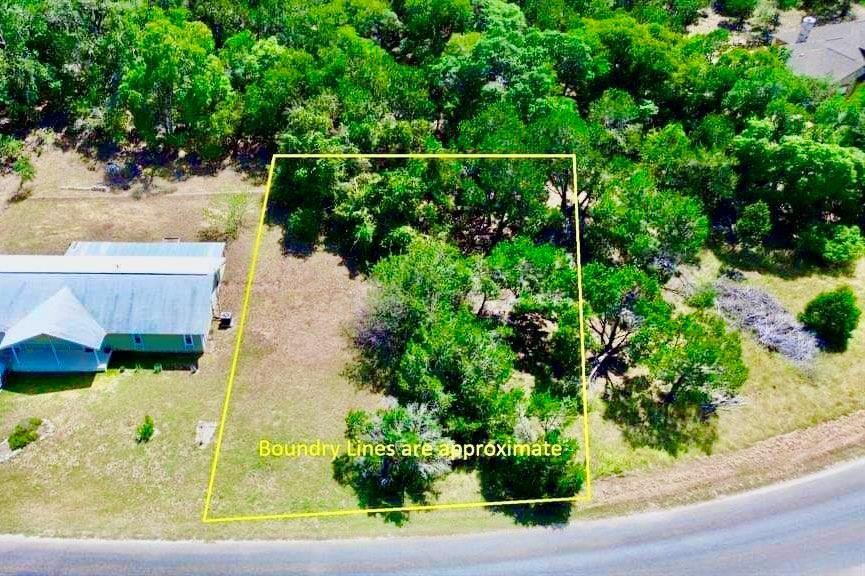 A verdant, tree-filled lot awaits your vision, bo