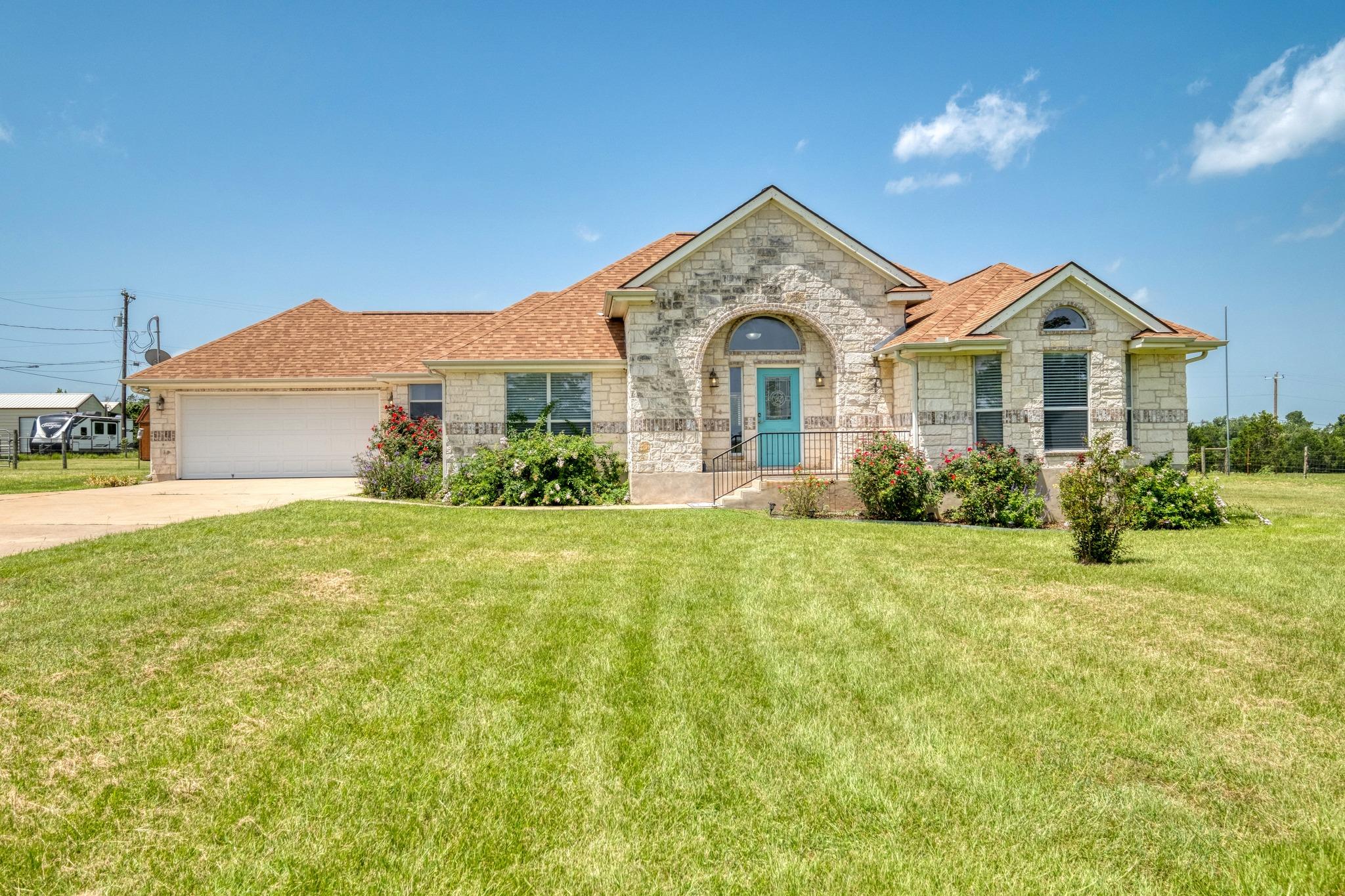 A well-maintained lawn welcomes visitors to this 