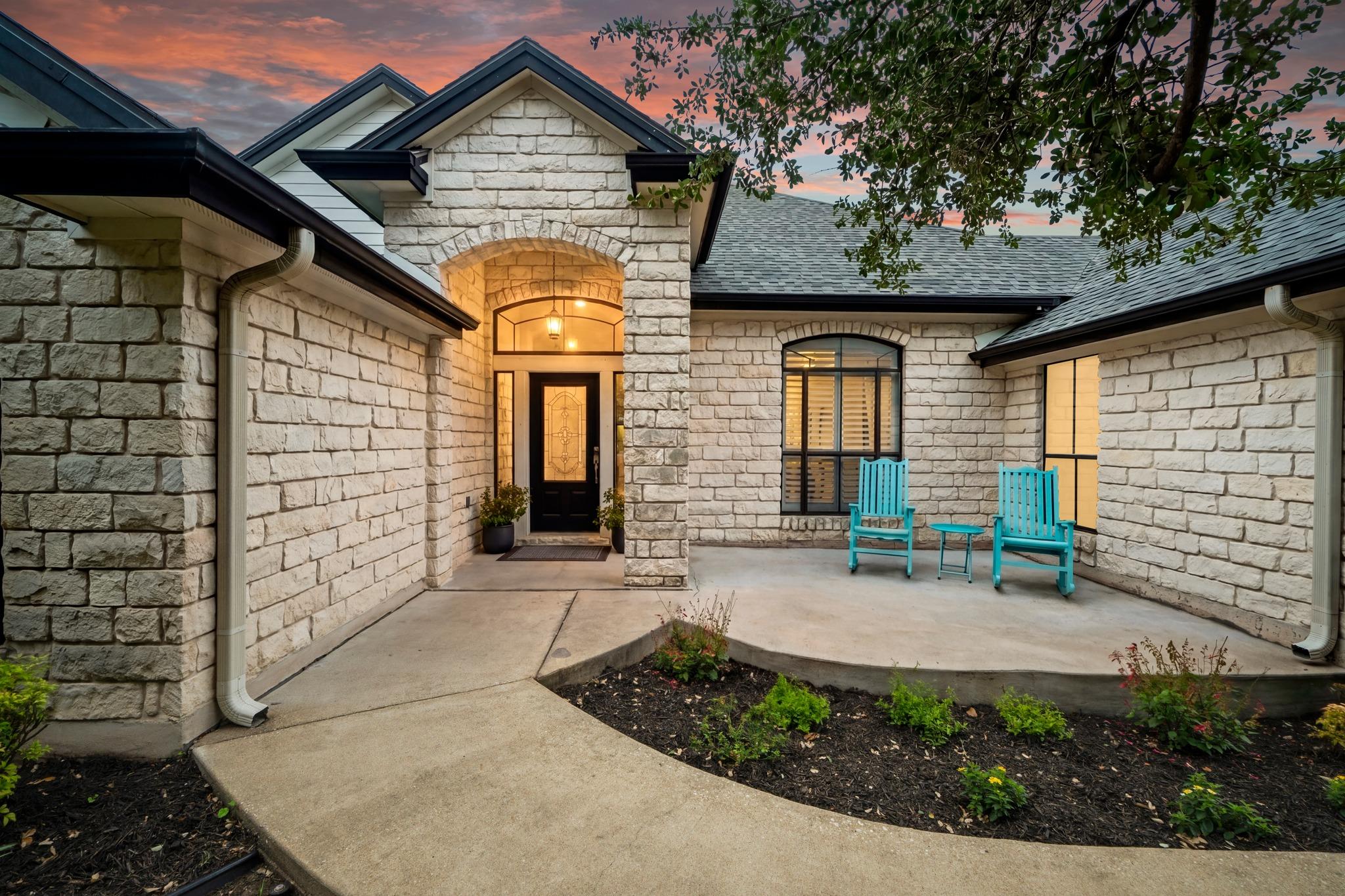 An inviting stone facade welcomes guests to this 