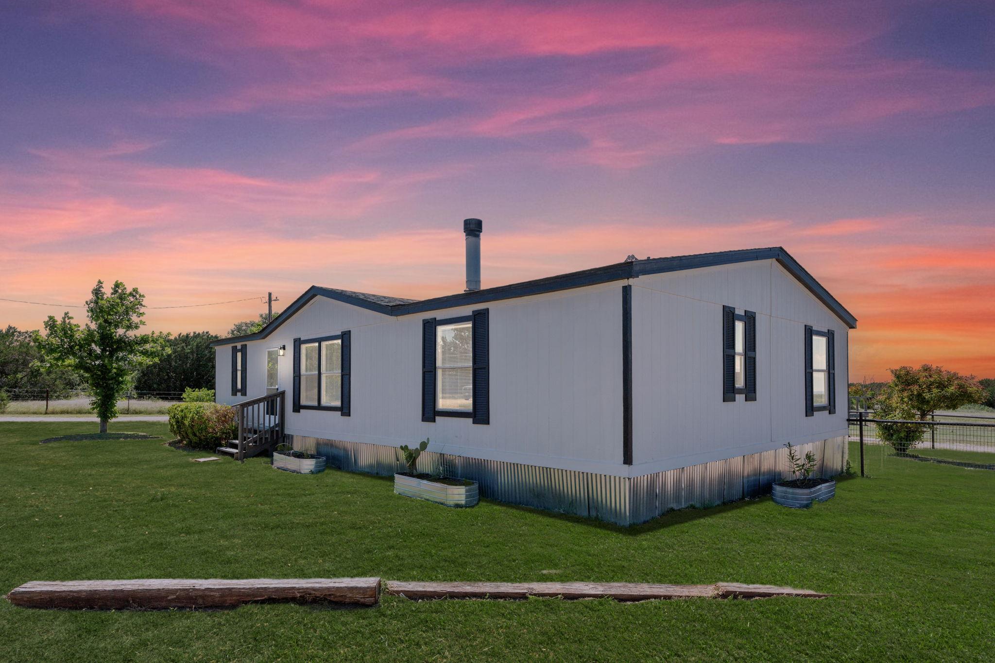 A quaint residence with a spacious lawn, perfectl