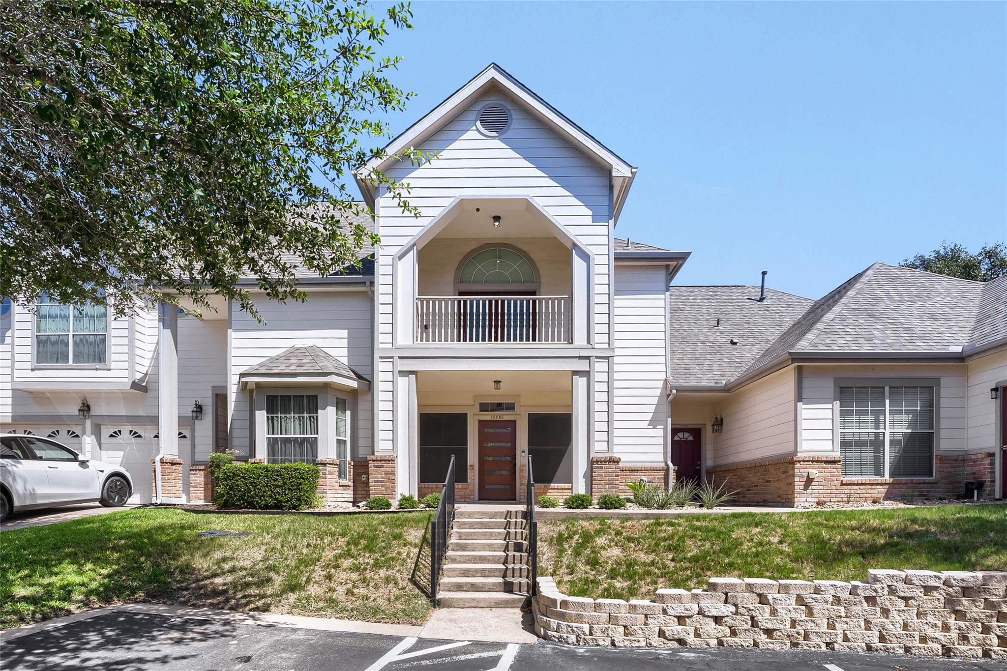A striking exterior presents a welcoming entryway