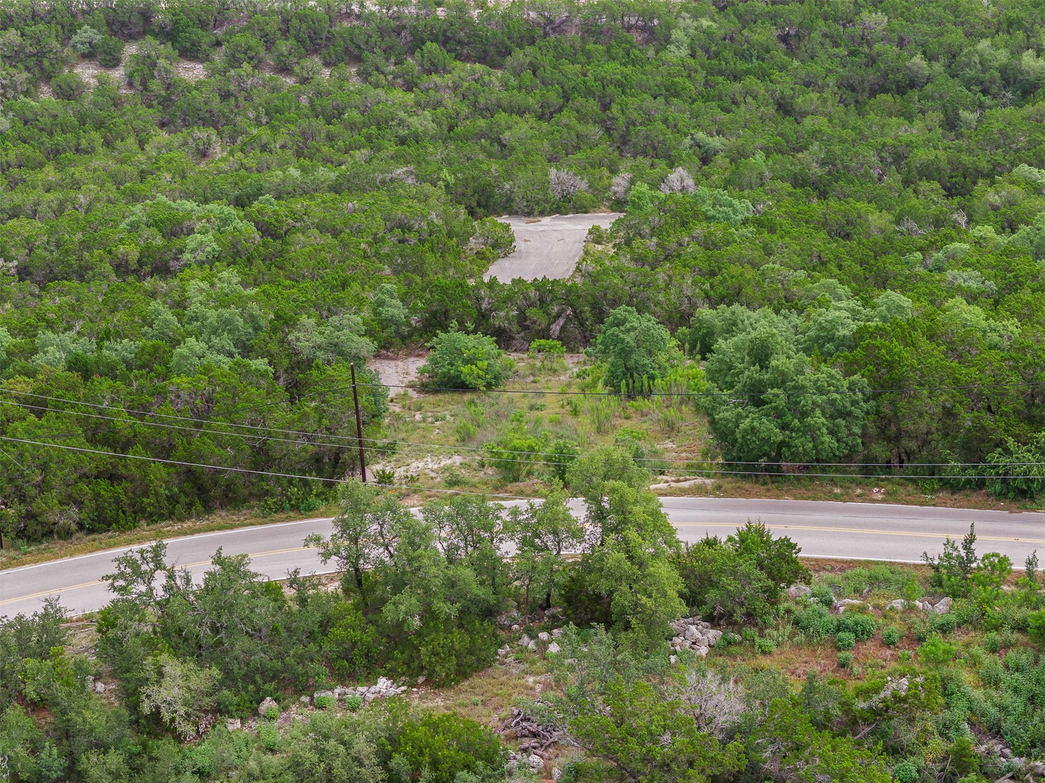 Discover a naturally wooded lot with paved roads,