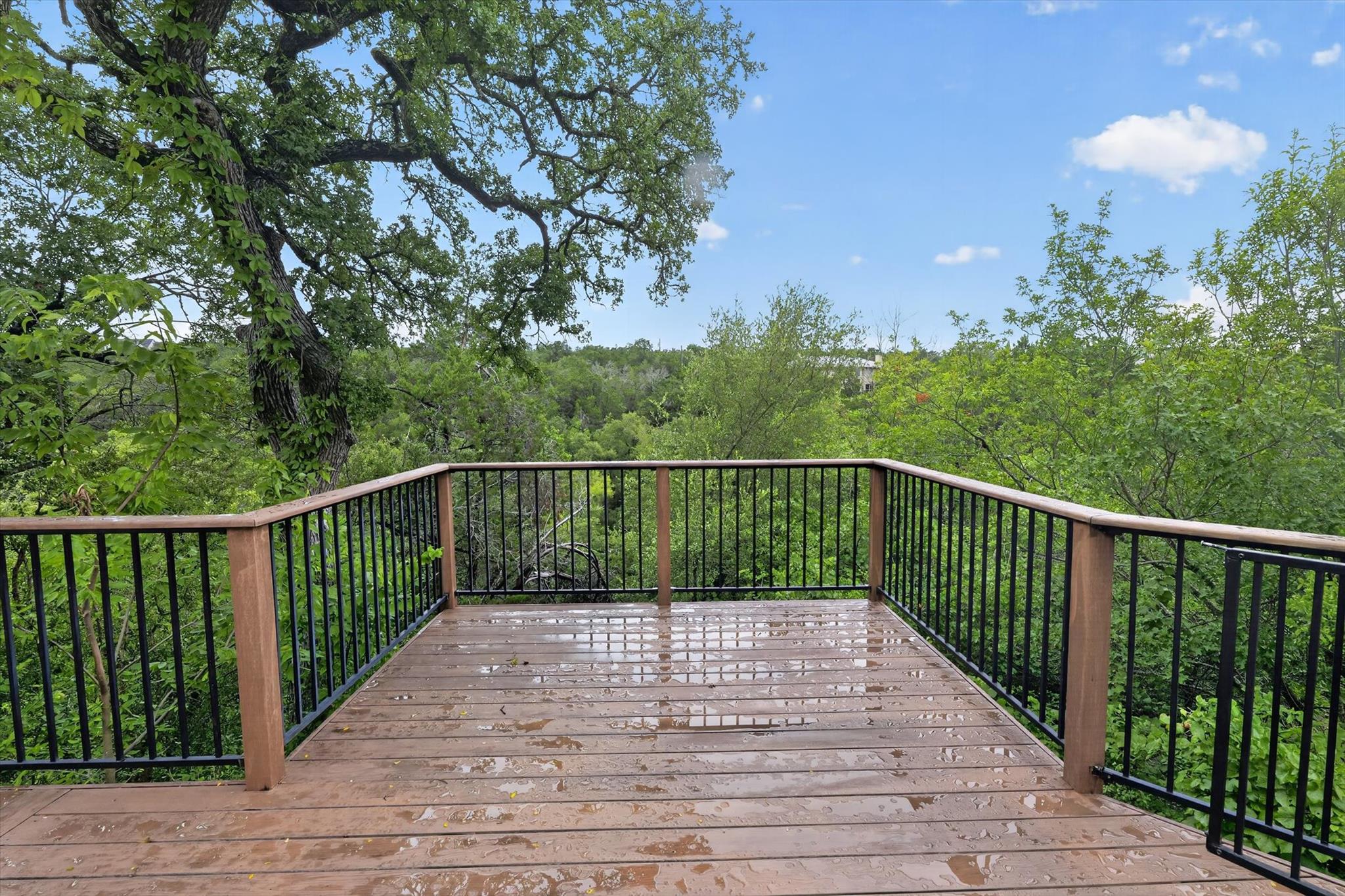 An inviting outdoor deck provides scenic views of