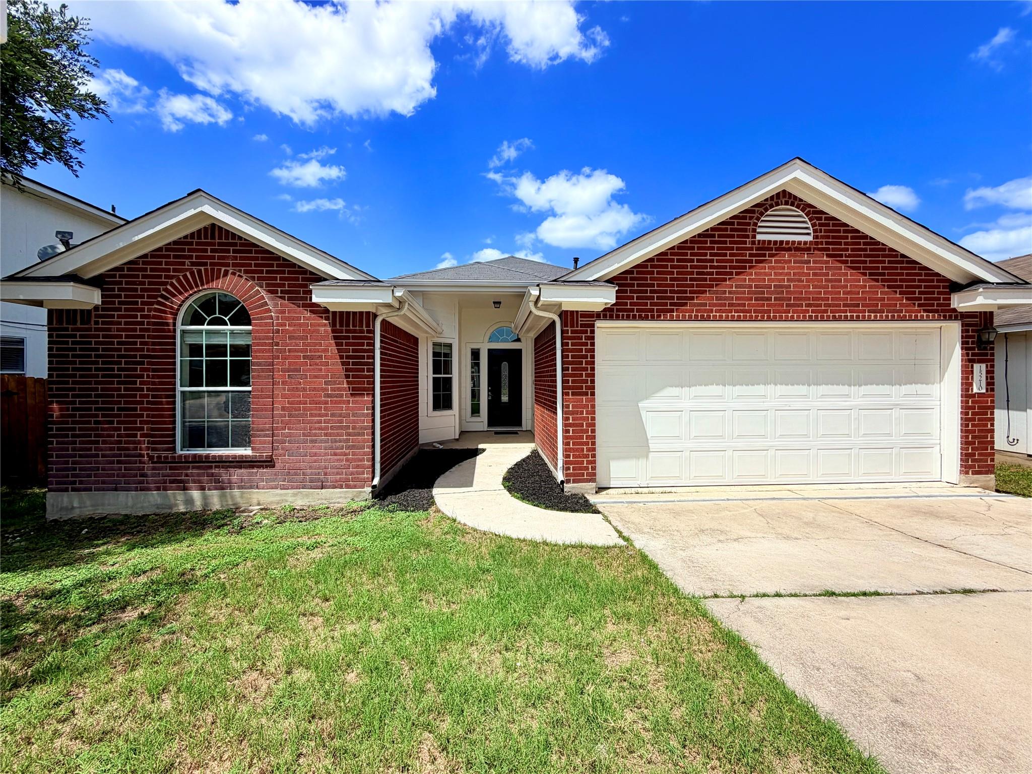 A classic brick exterior with a welcoming entrywa