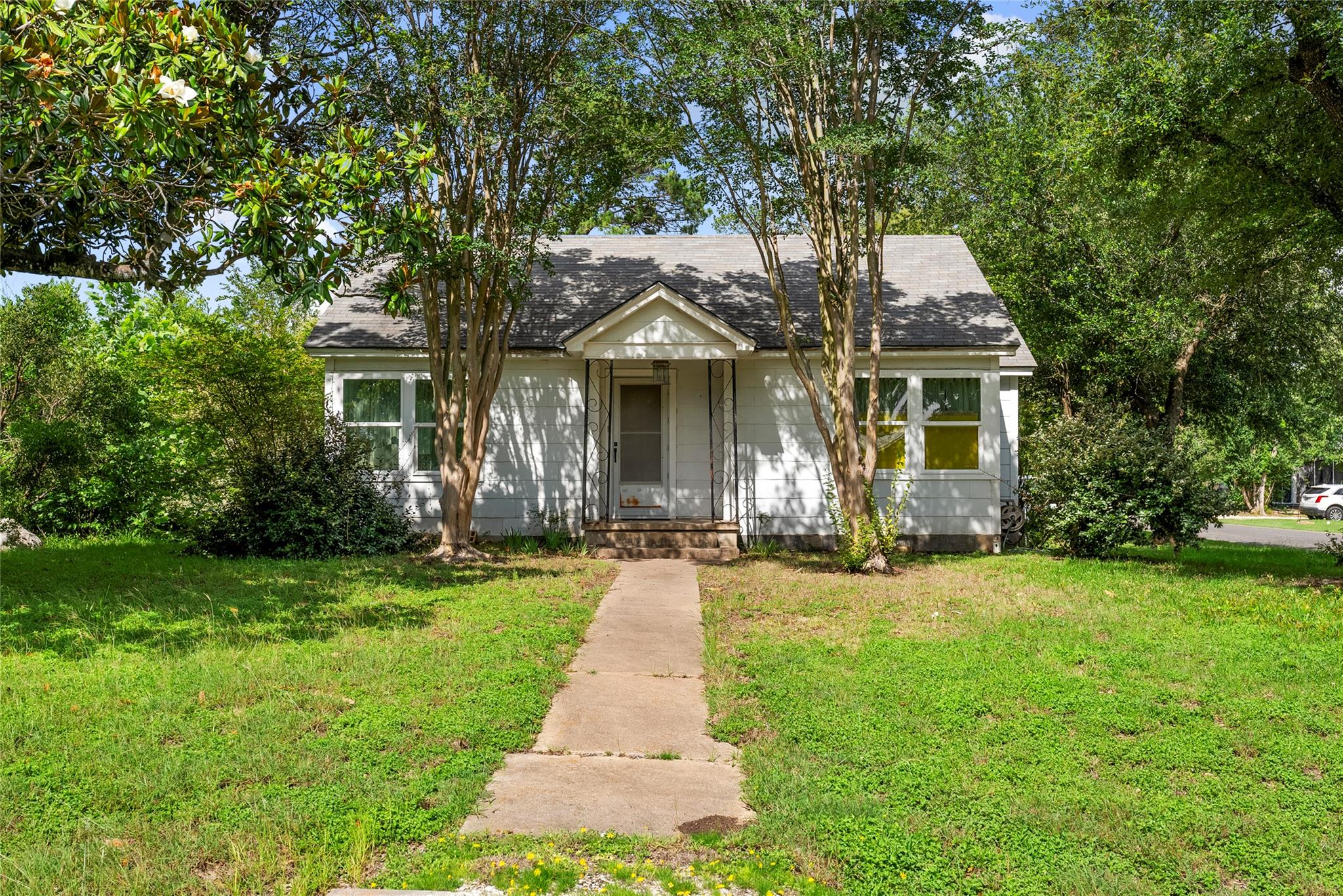 A charming single-family home awaits, set back fr
