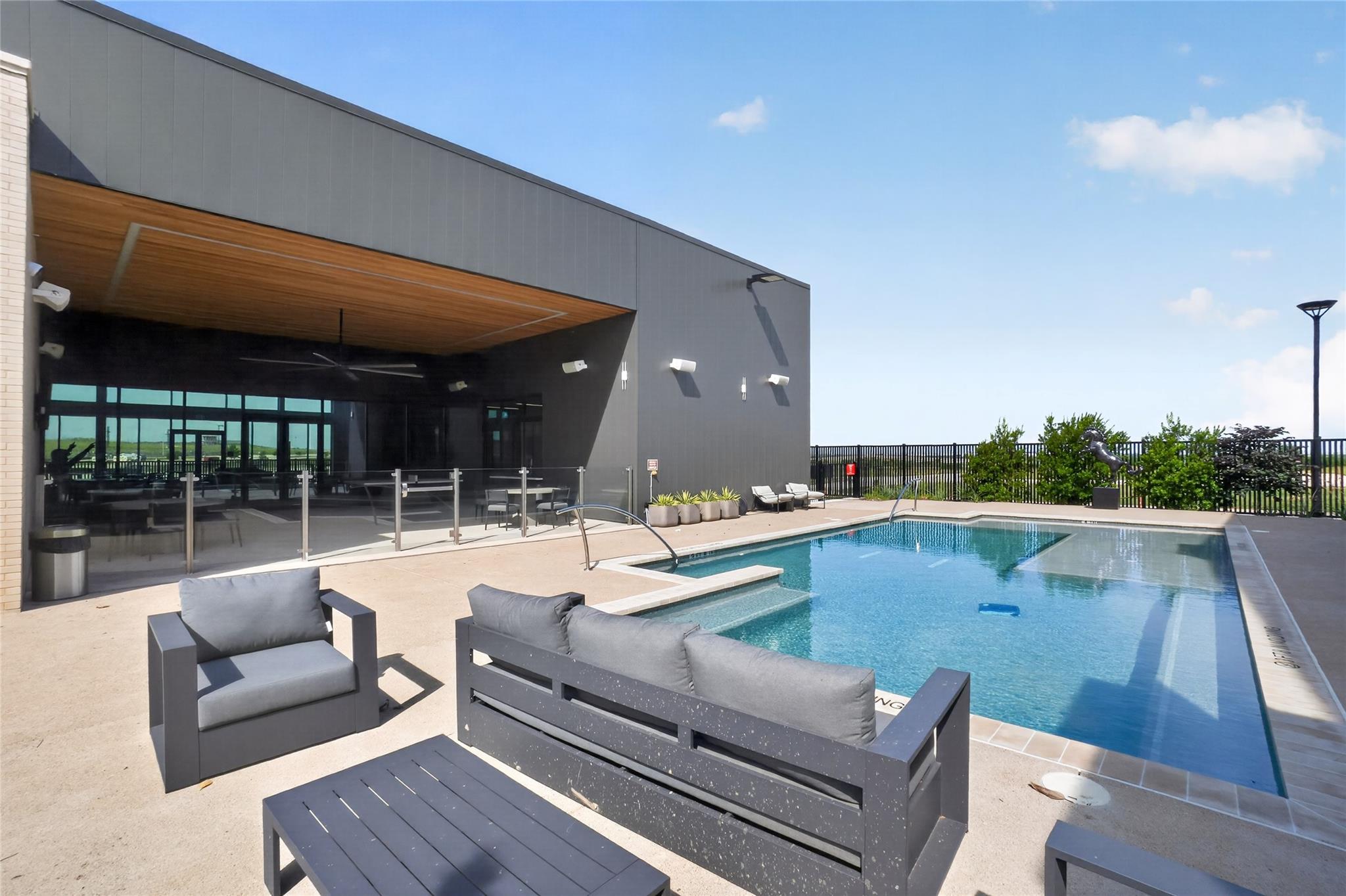 An inviting outdoor oasis with a sparkling pool o