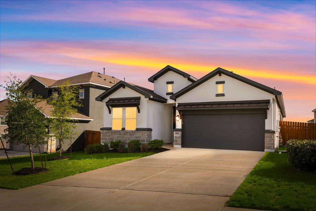 A striking modern facade with stone accents and a