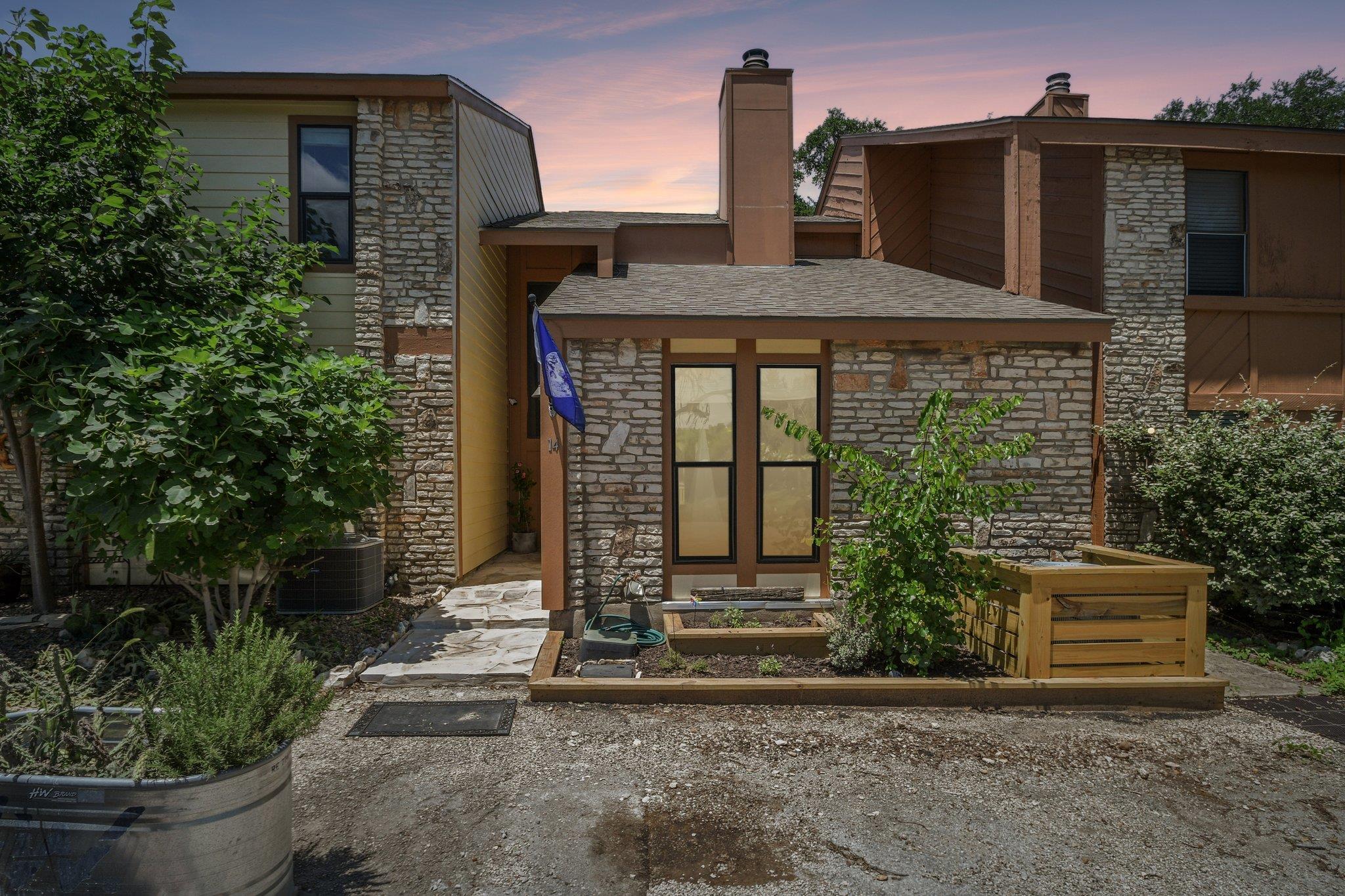 Stone and siding create an inviting exterior with