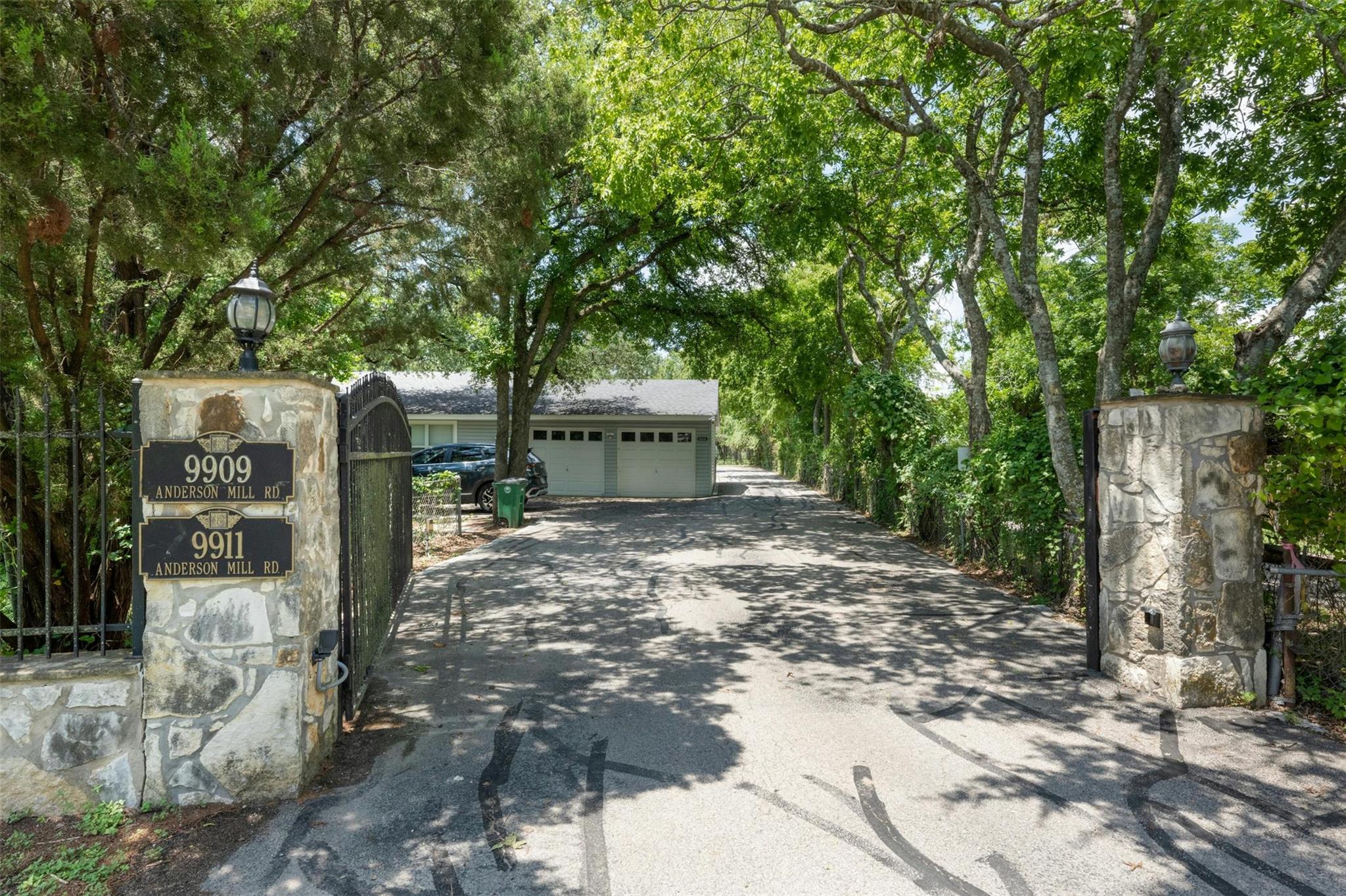Secure, private drive leads to a secluded garage 