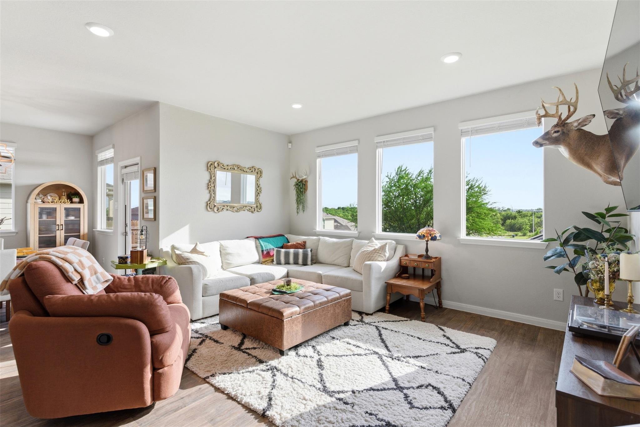 The inviting living area features warm wood-look 