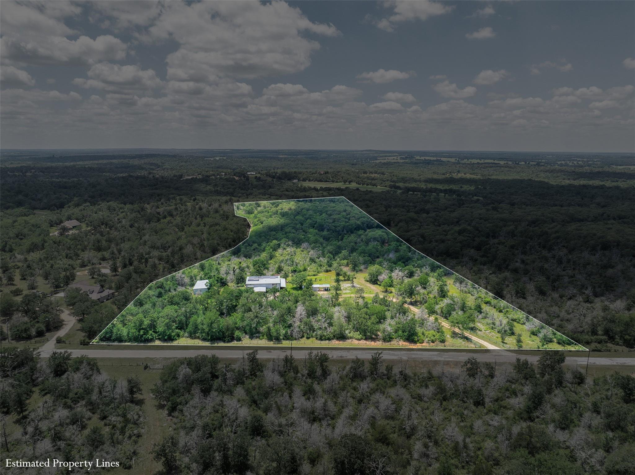 An aerial perspective reveals a vast, wooded esta