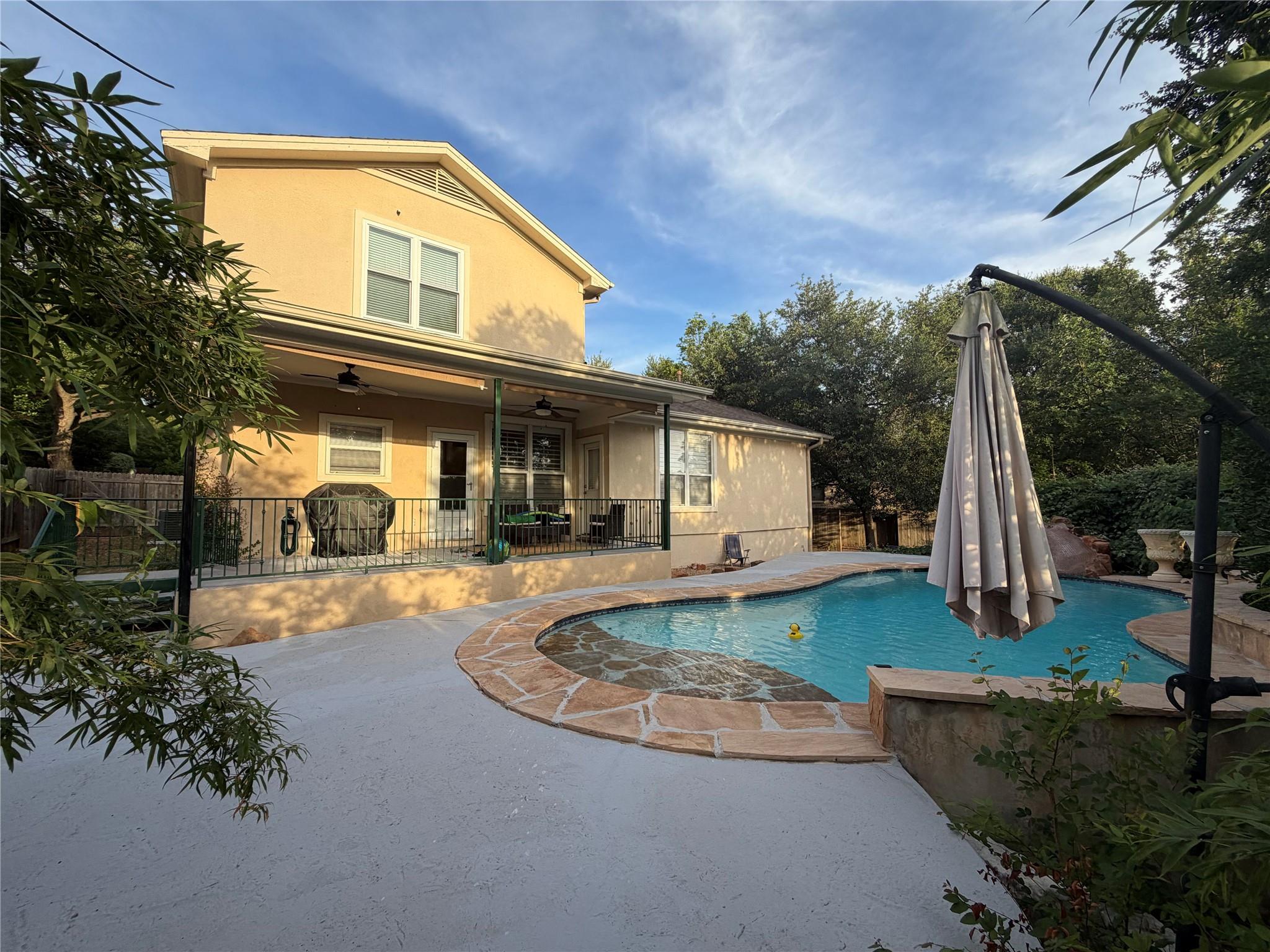 A tranquil backyard oasis awaits, featuring a ref
