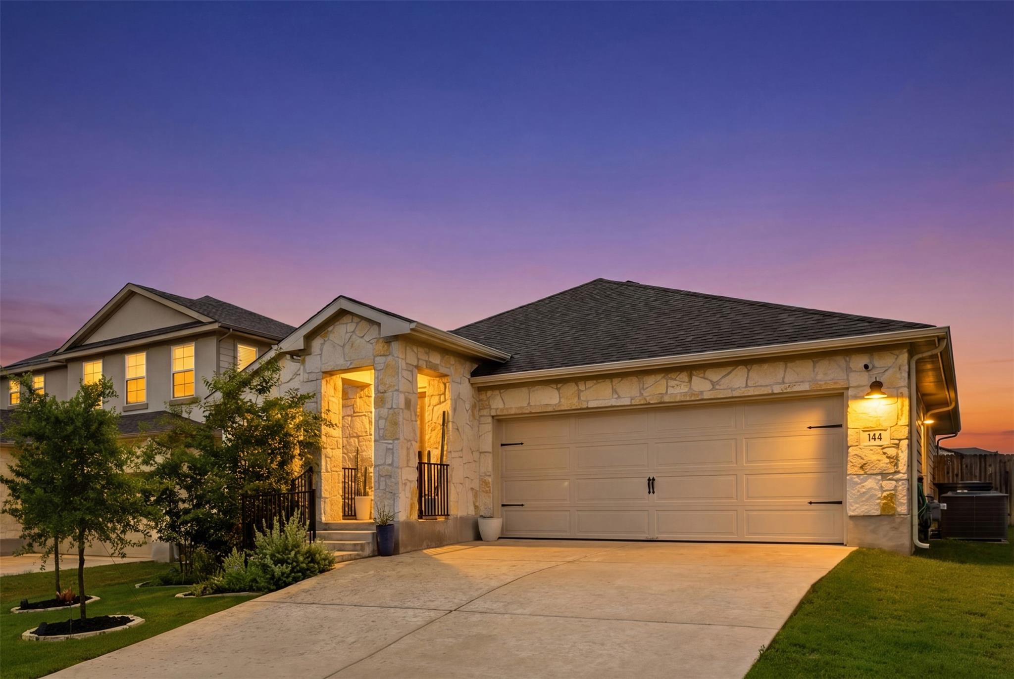 Stone facade and a welcoming porch highlight this