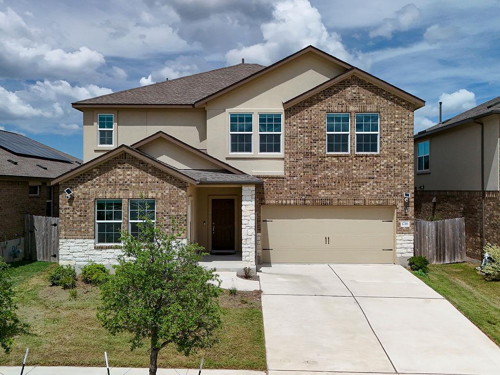 A well-kept front facade features a harmonious bl
