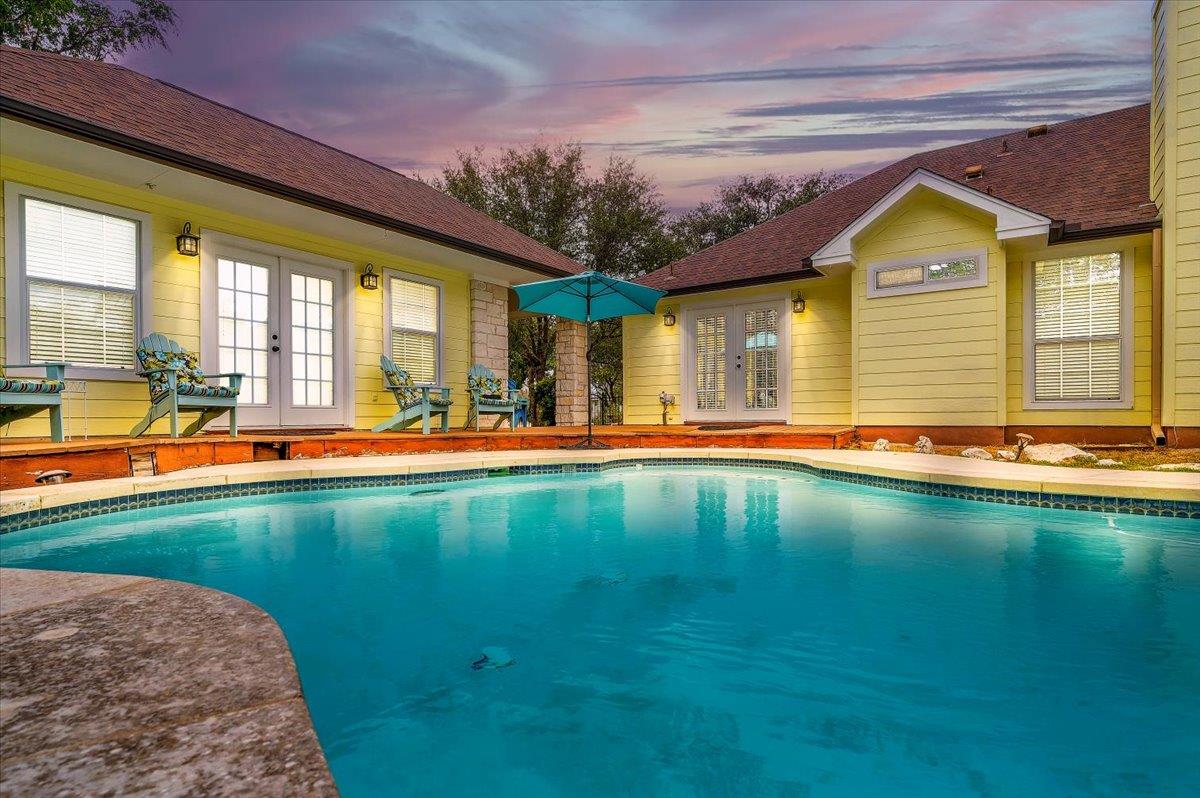 An inviting backyard oasis awaits with a sparklin
