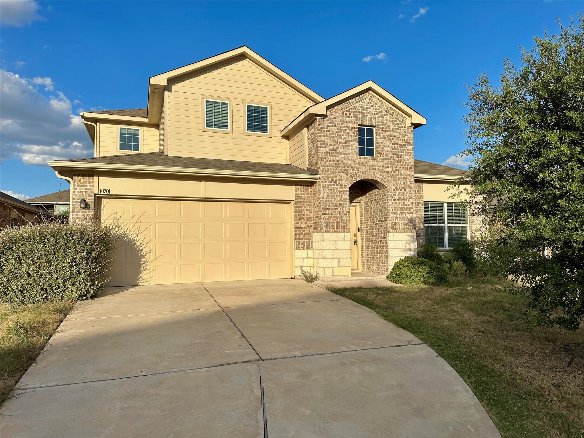 An arched brick entryway highlights the exterior 
