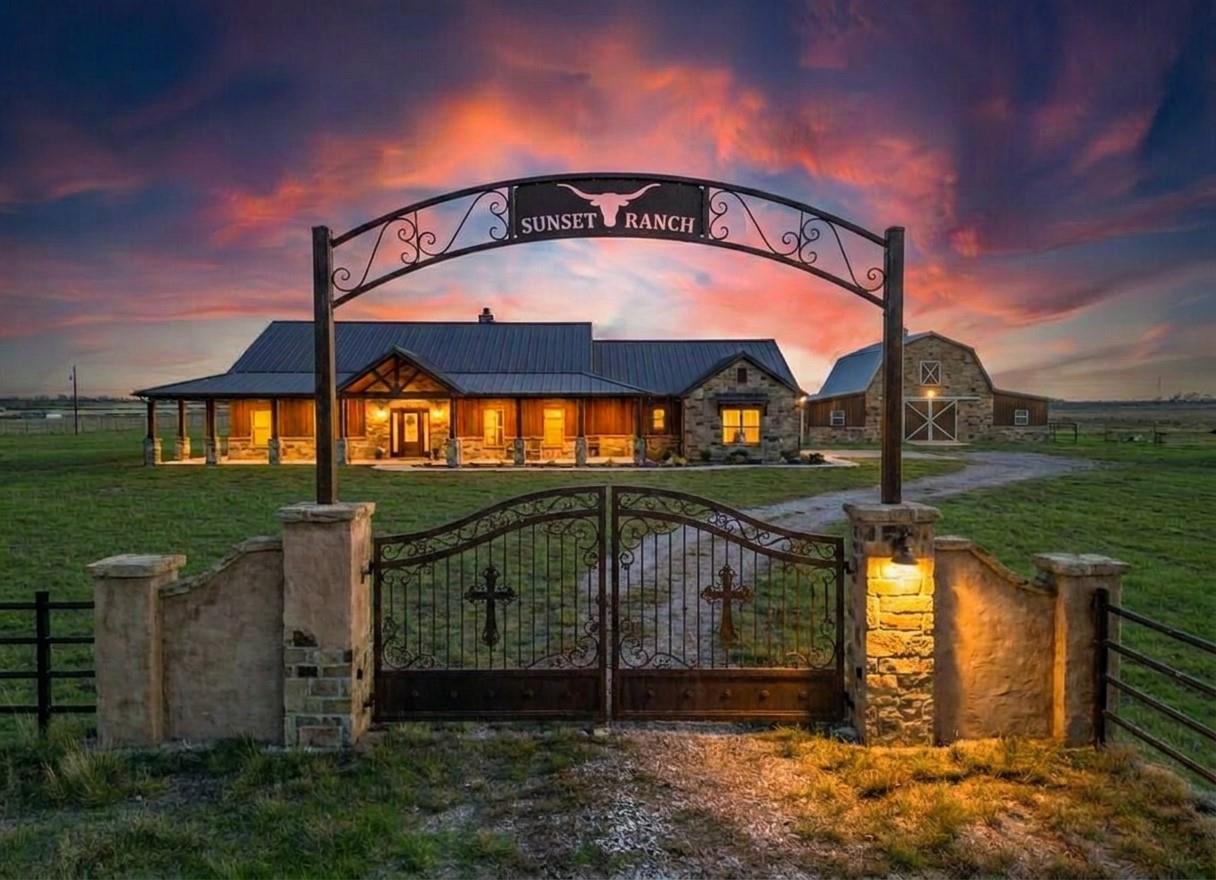 Secure entry through ornate gates leads to a welc