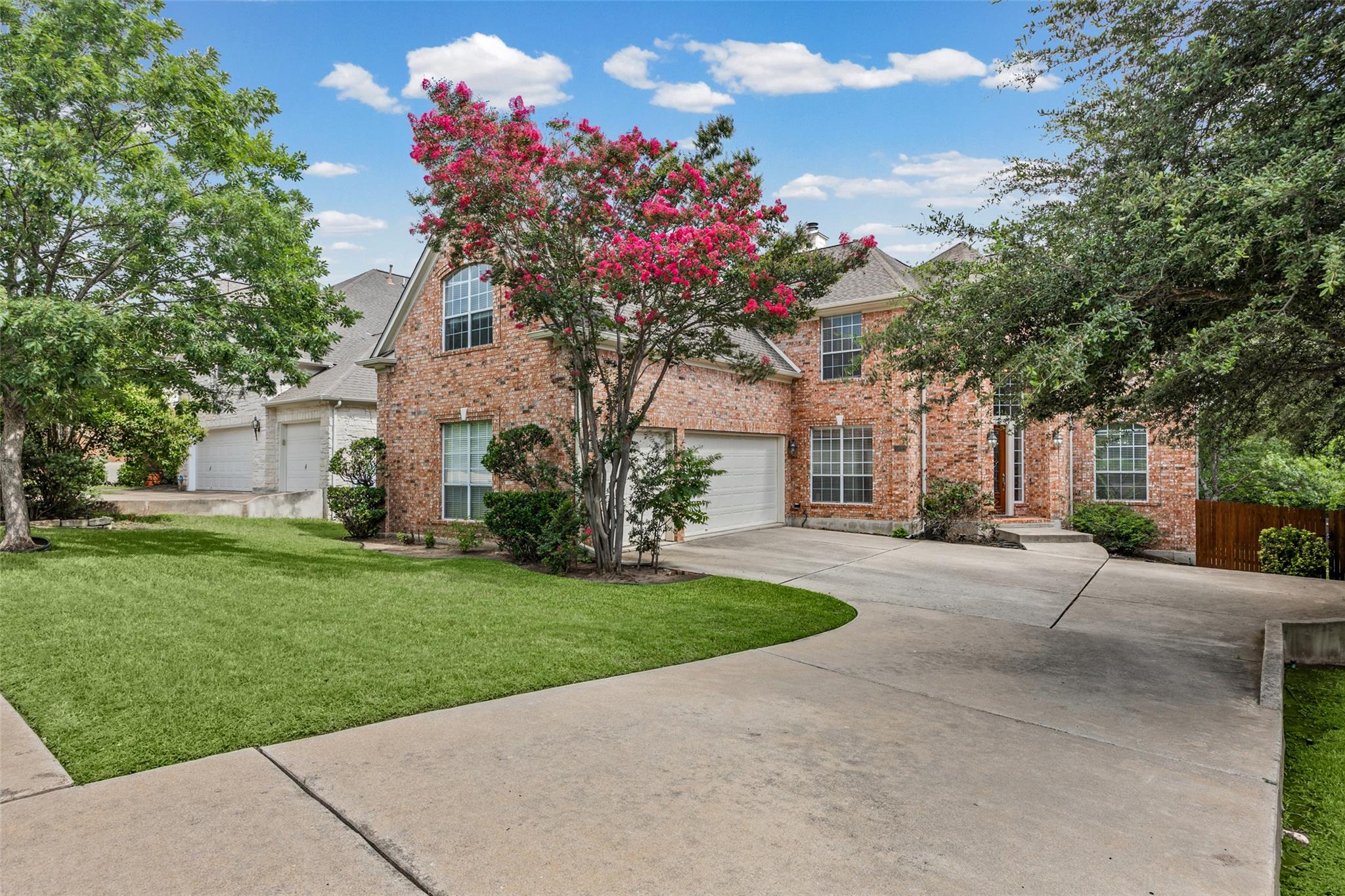 A classic brick exterior with multiple garage bay
