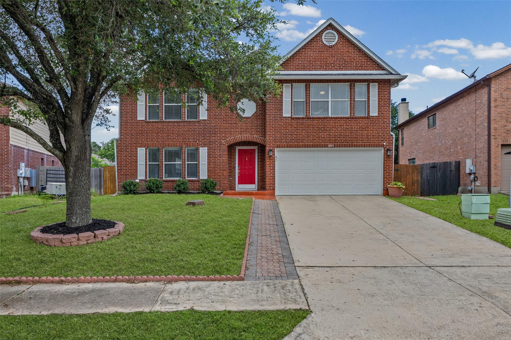 A well-maintained brick facade home awaits, featu