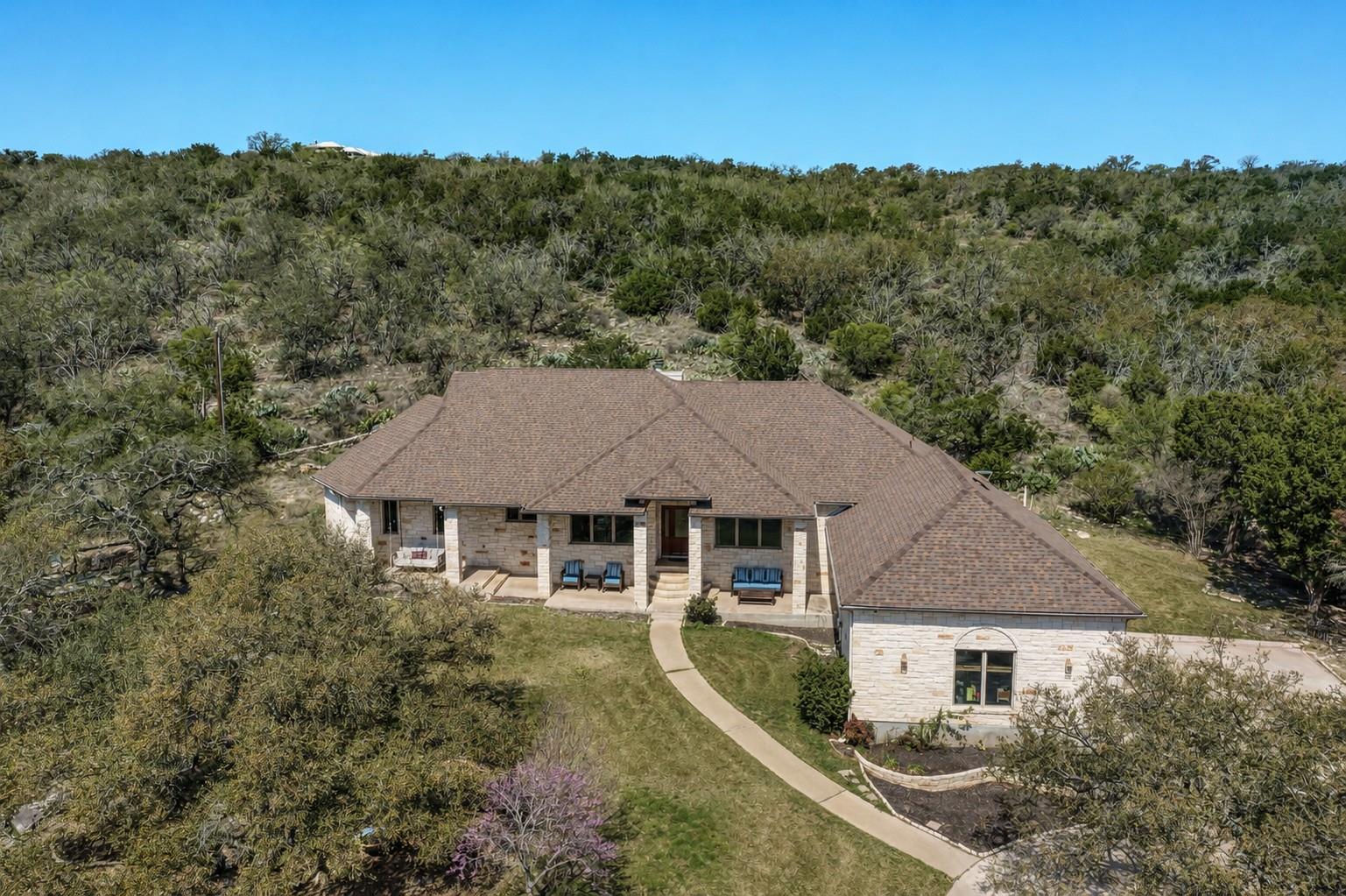 A spacious home nestled amidst lush, natural land
