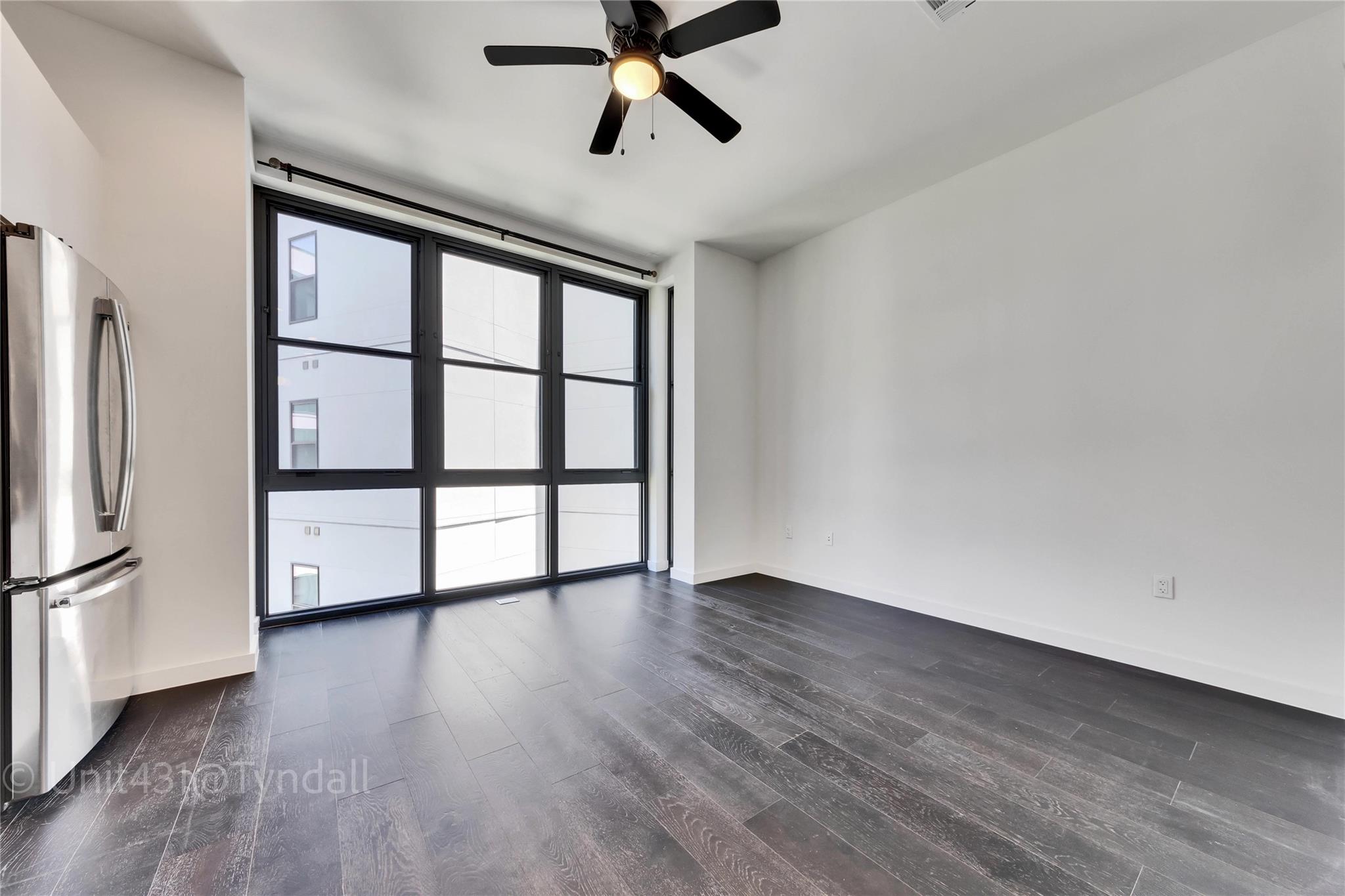 Floor-to-ceiling windows illuminate this expansiv