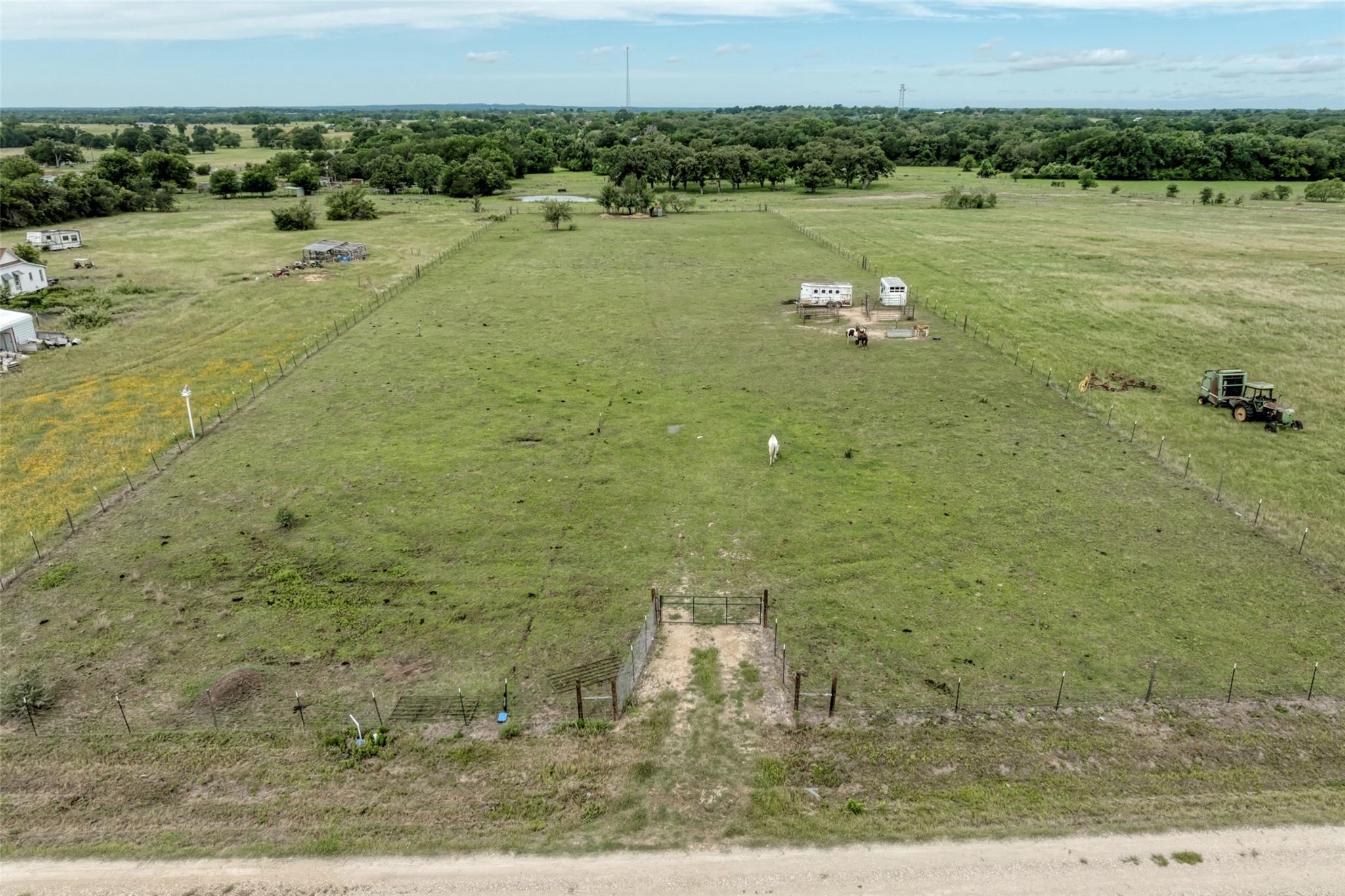 A sprawling agricultural estate awaits, fenced fo