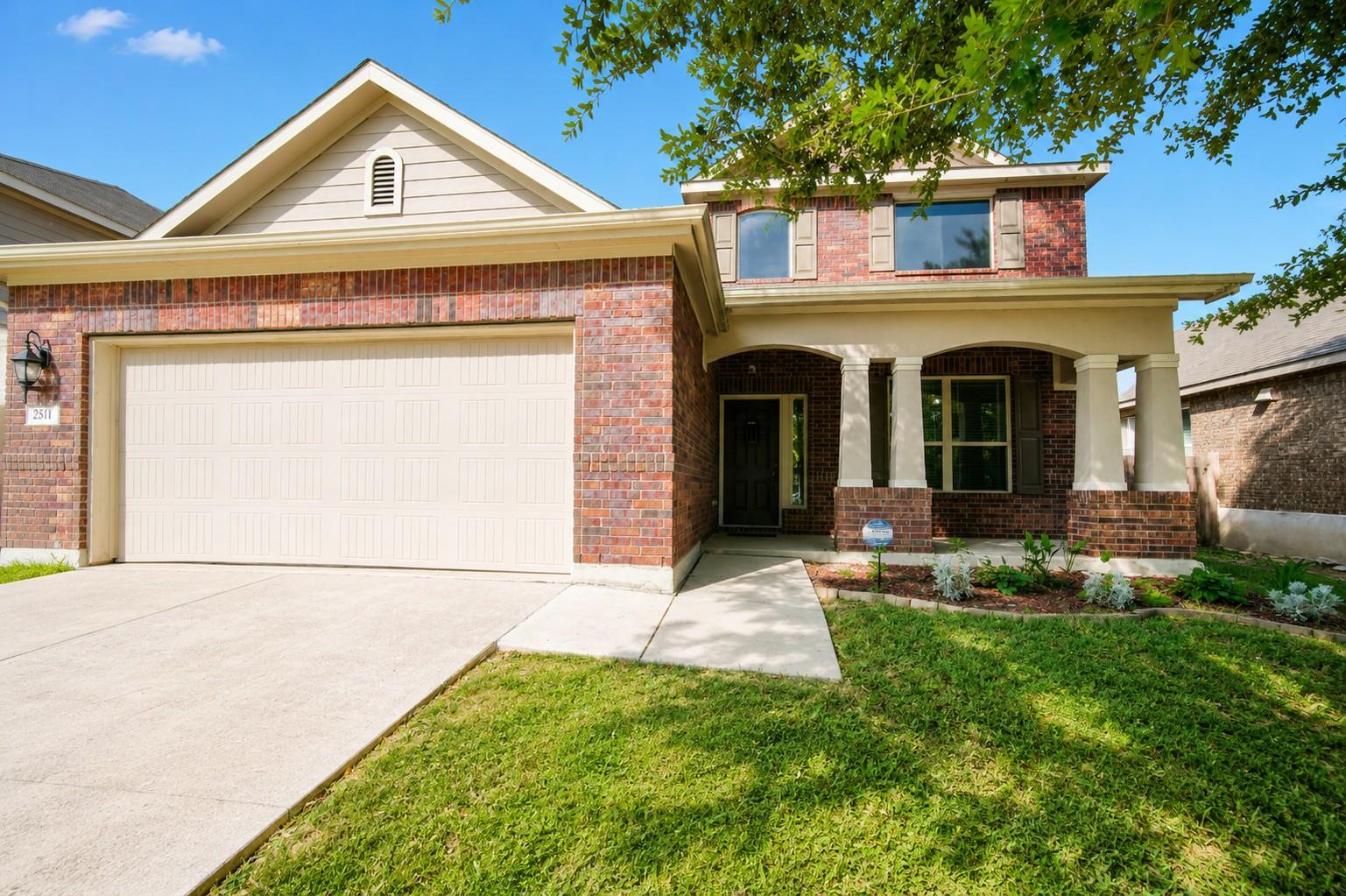 A classic brick exterior with a welcoming covered