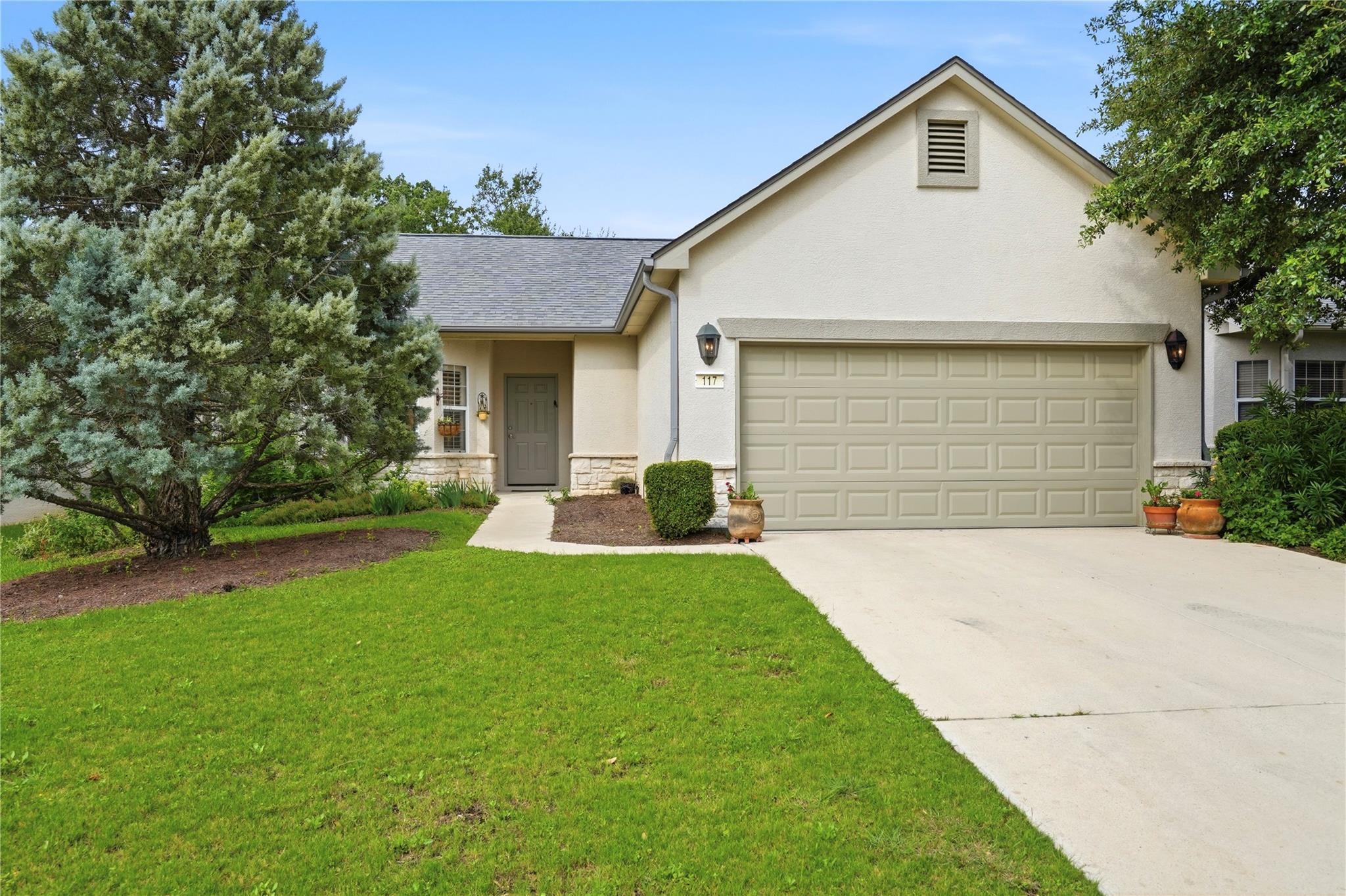 A welcoming facade with a well-maintained lawn an