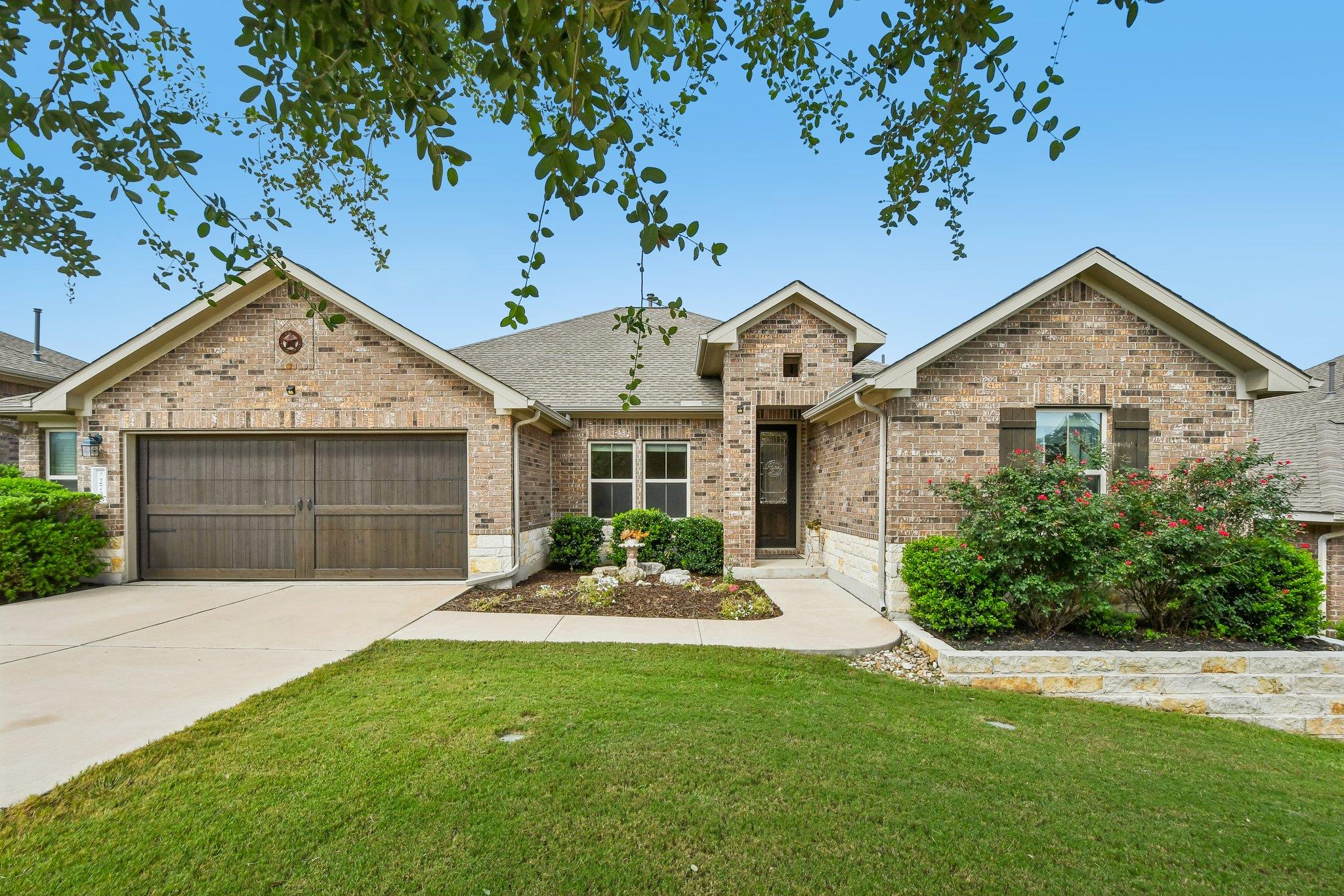 A classic brick facade welcomes with a charming f