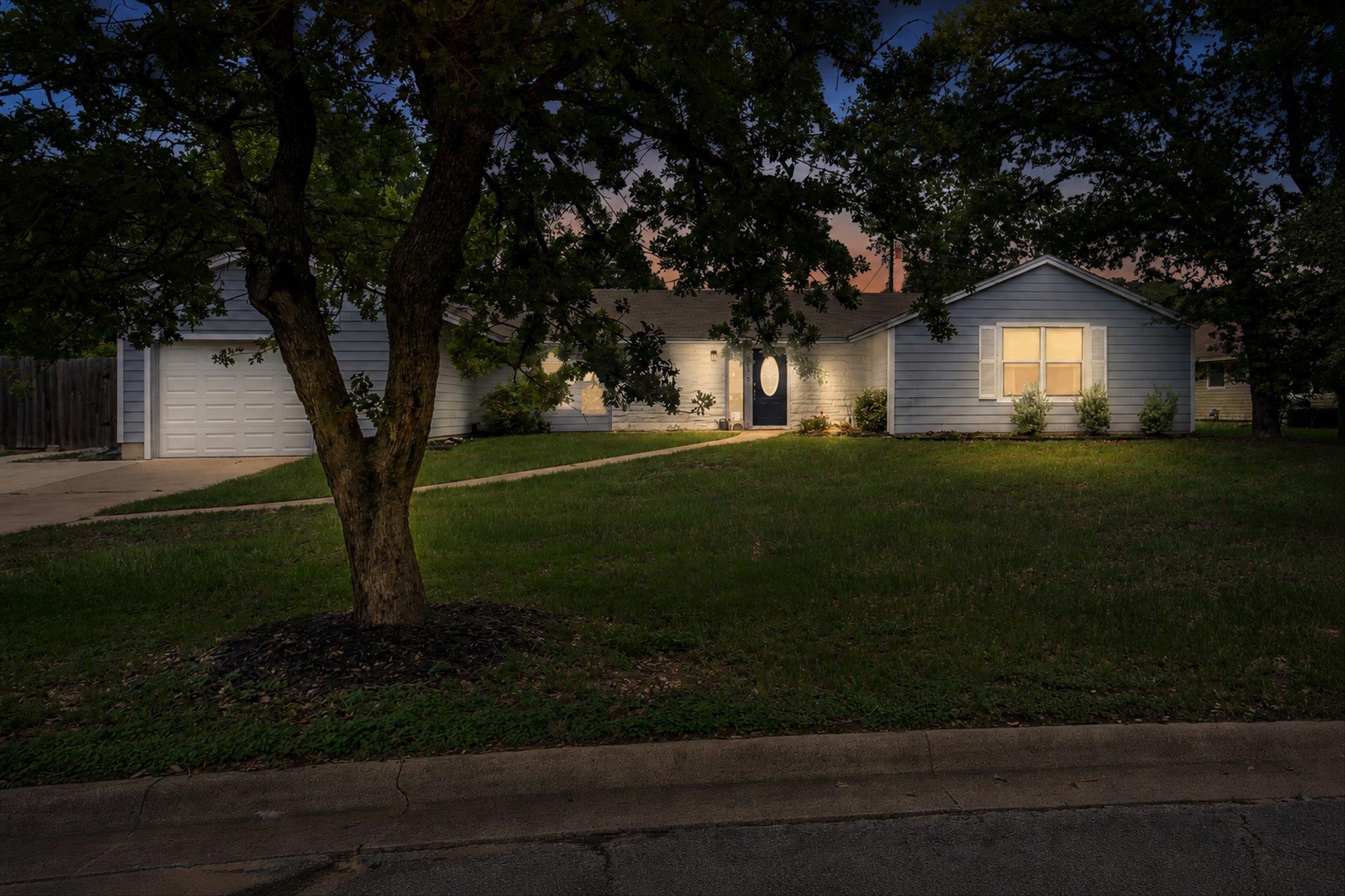 A well-maintained ranch-style home beckons from a