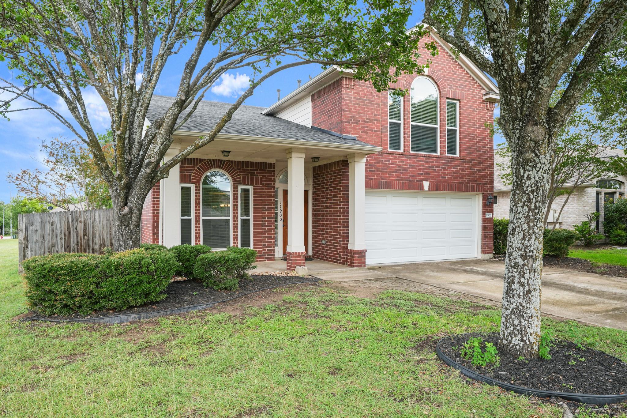 A classic brick exterior with a welcoming covered