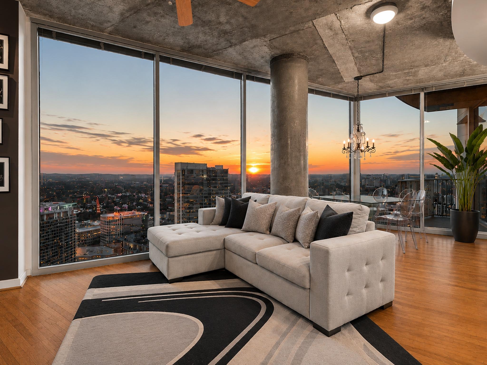 Floor-to-ceiling windows frame dramatic city suns