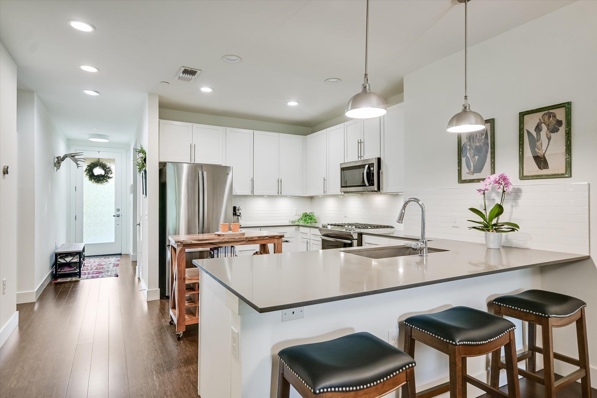 Bright, open-concept kitchen features a spacious 