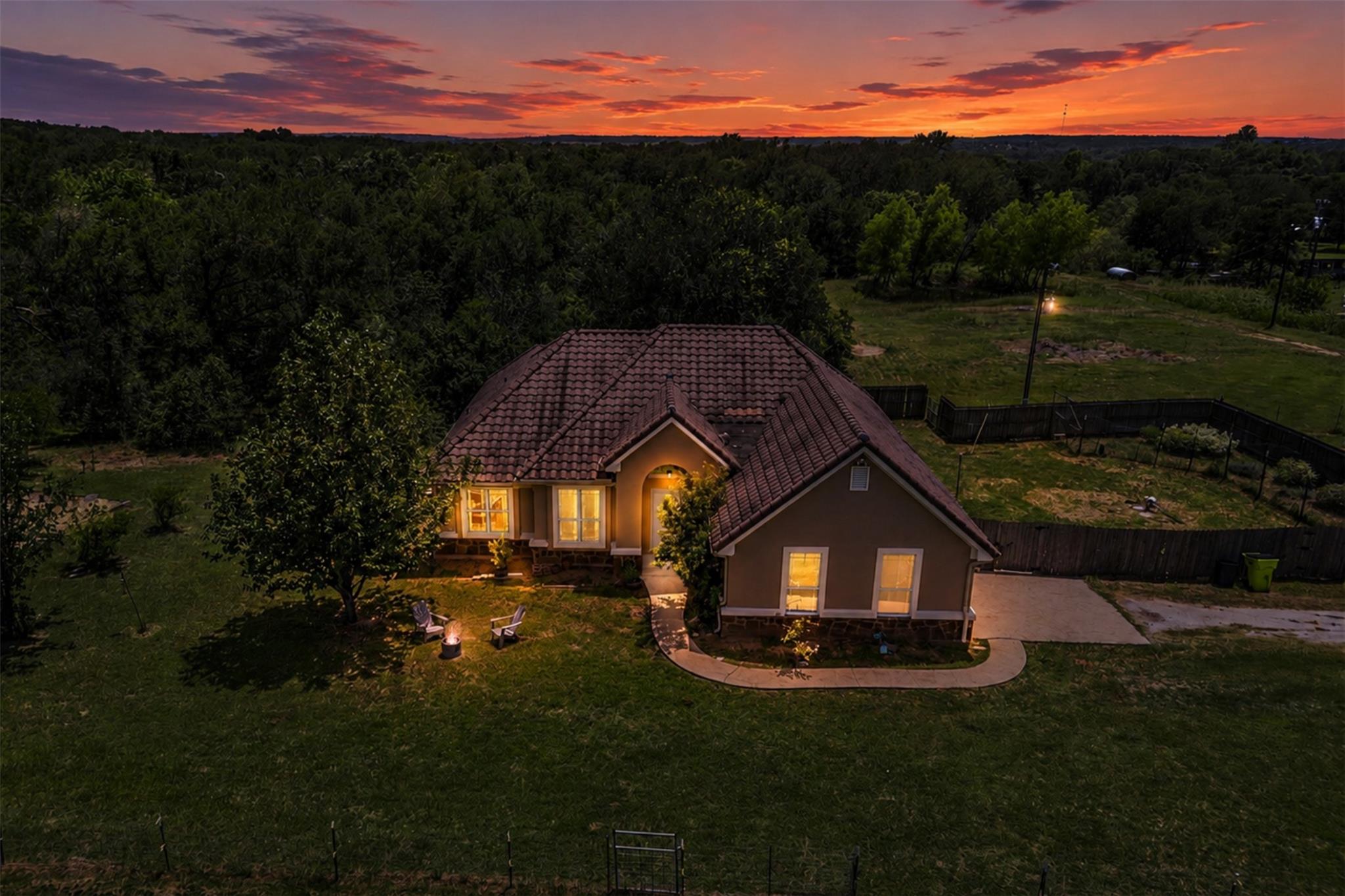 An inviting exterior welcomes under a dramatic tw