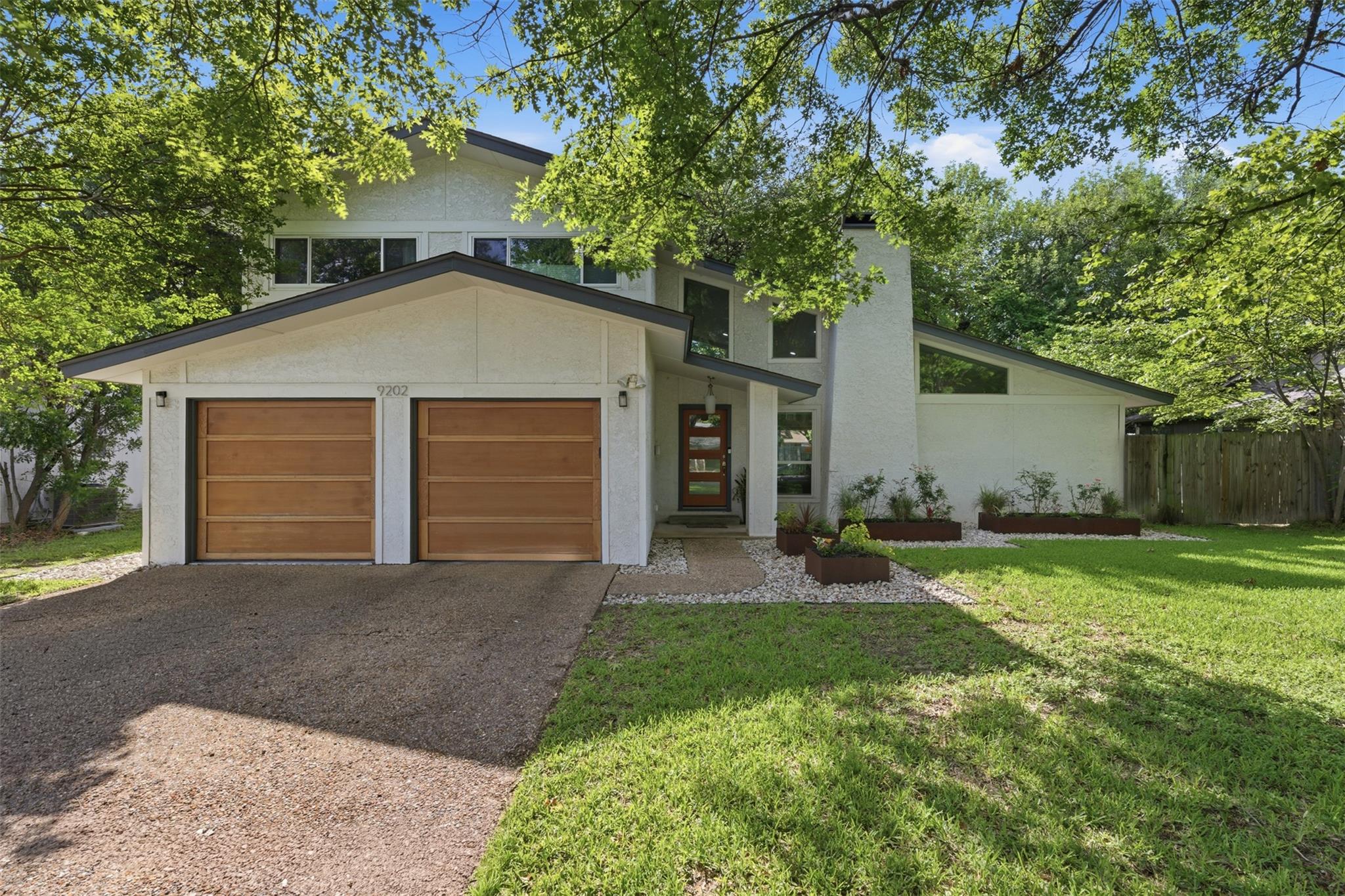 Modern architecture with warm wooden garage doors