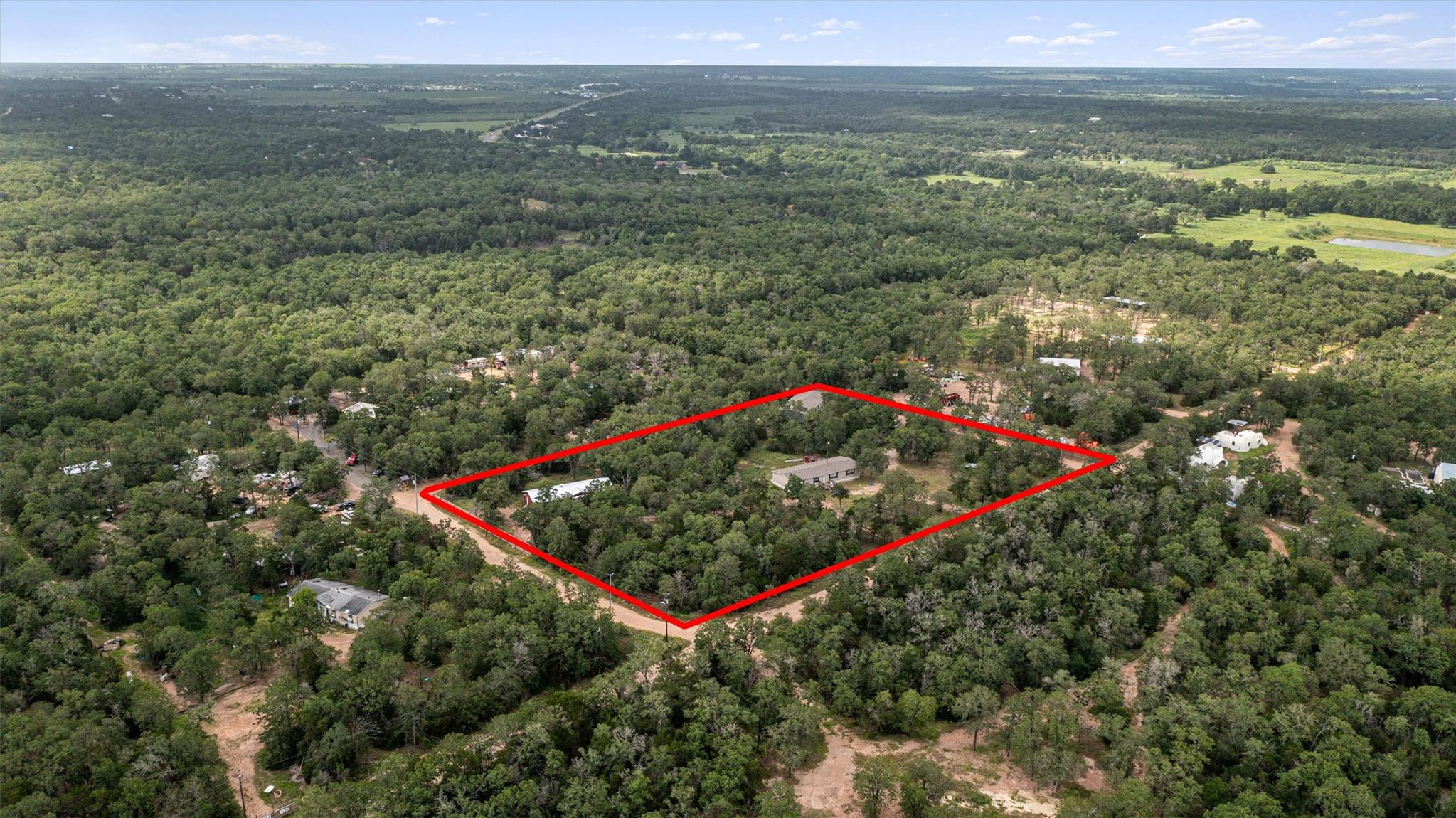 An aerial perspective showcases a secluded home e