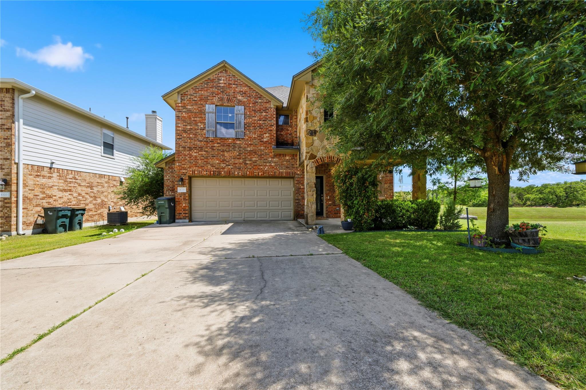 Brick and stone accents adorn this charming home,
